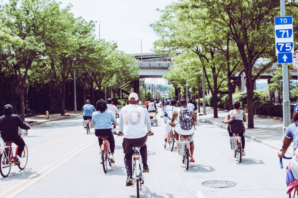 People cycling on the whole street