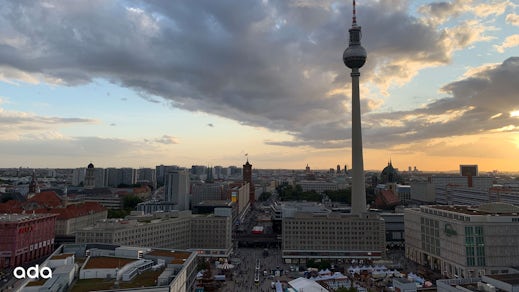 A skyline view of Berlin showcasing the buildings and the Fernsehturm, or TV tower.