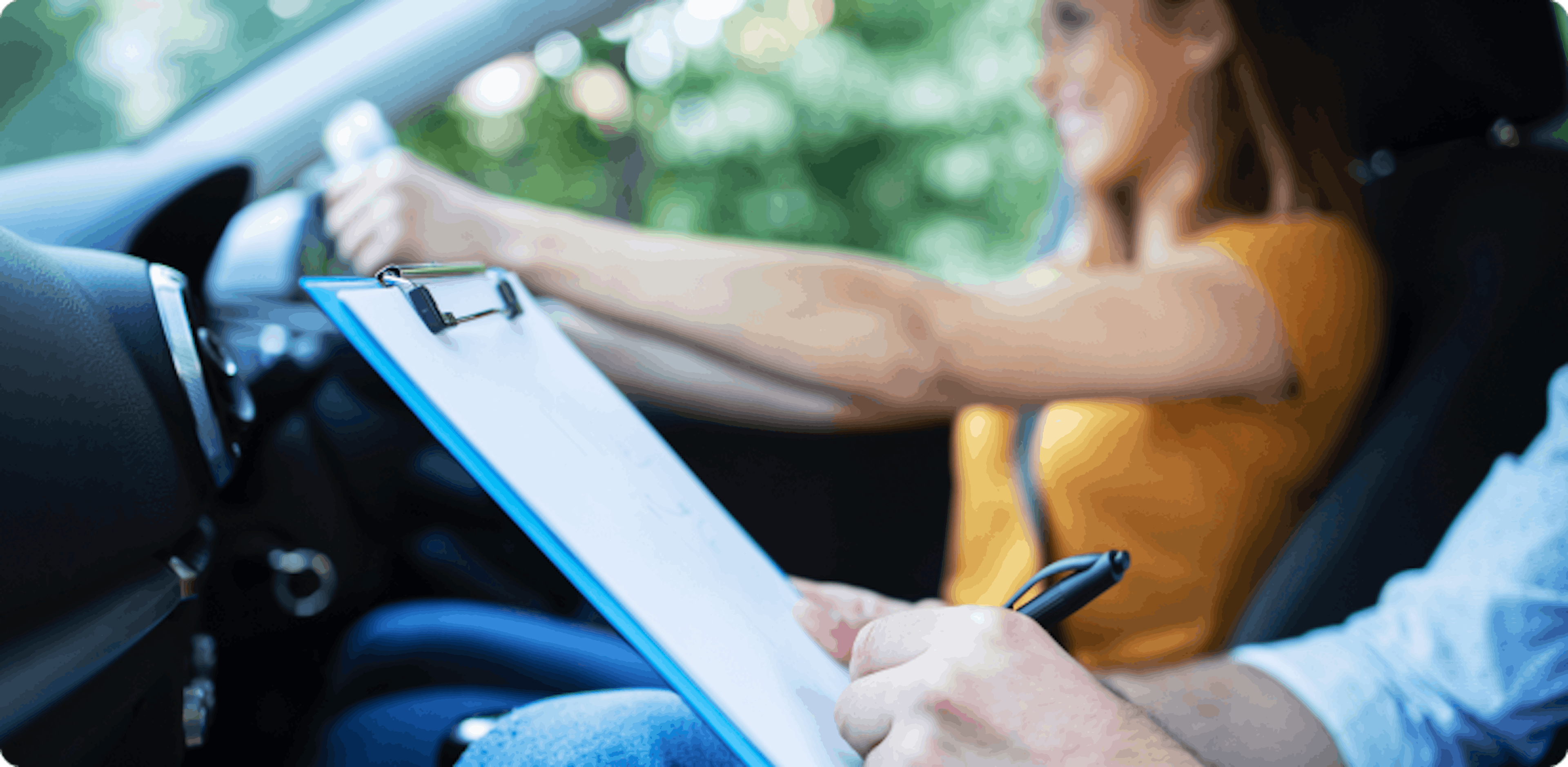 Close up view of a driving instructor applying their free driving instructor training during a lesson with a student