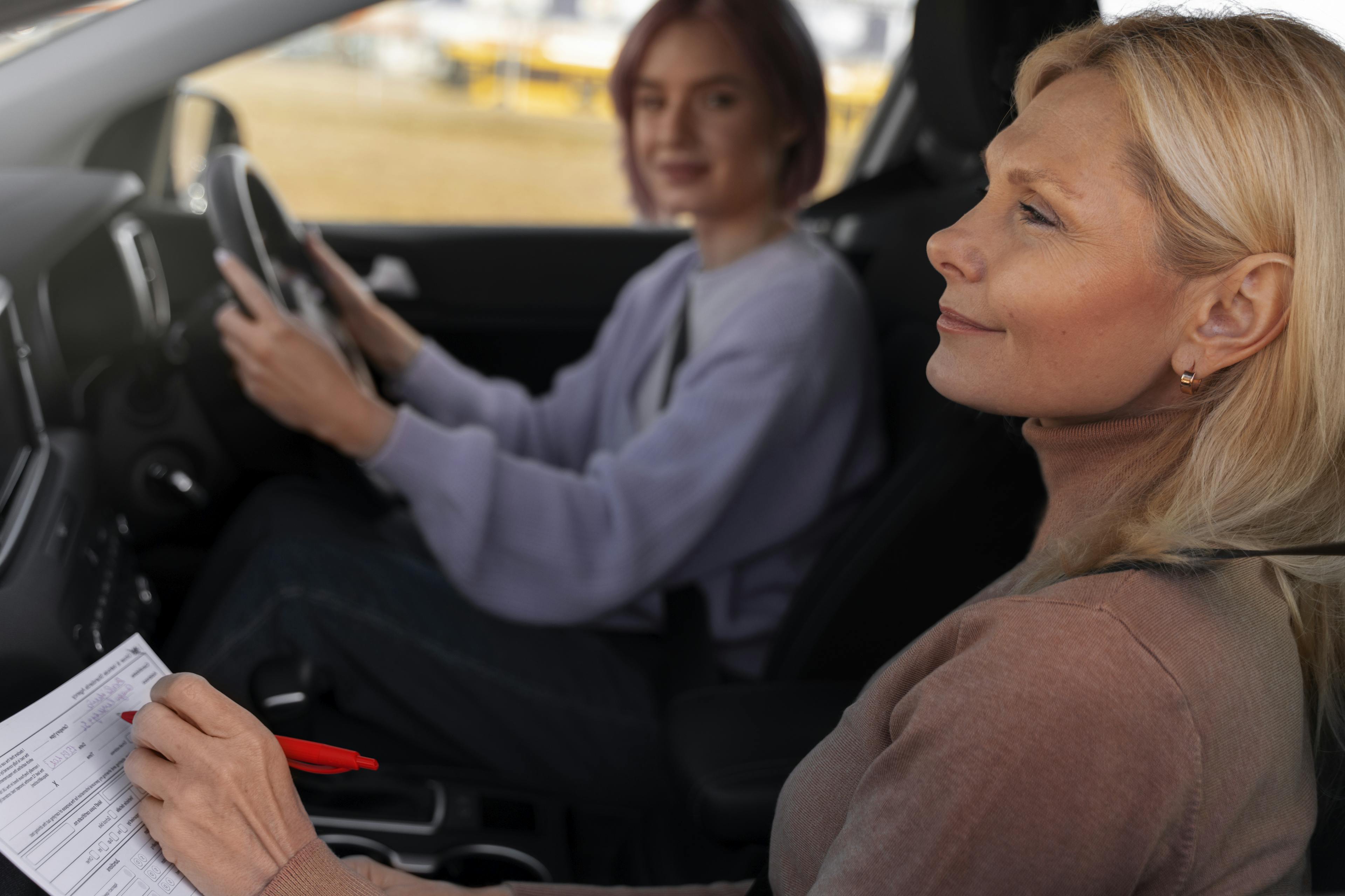 A driving instructor helping her learner become a safe and responsible driver