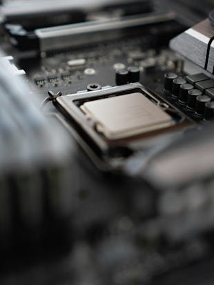 Close-up of a printed circuit board (PCB) with focus on a single electronic component, highlighting precision engineering in modern electronics manufacturing