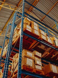 High-bay warehouse storage system filled with pallets of electronic components, showcasing efficient logistics and bulk inventory management in wholesale distribution