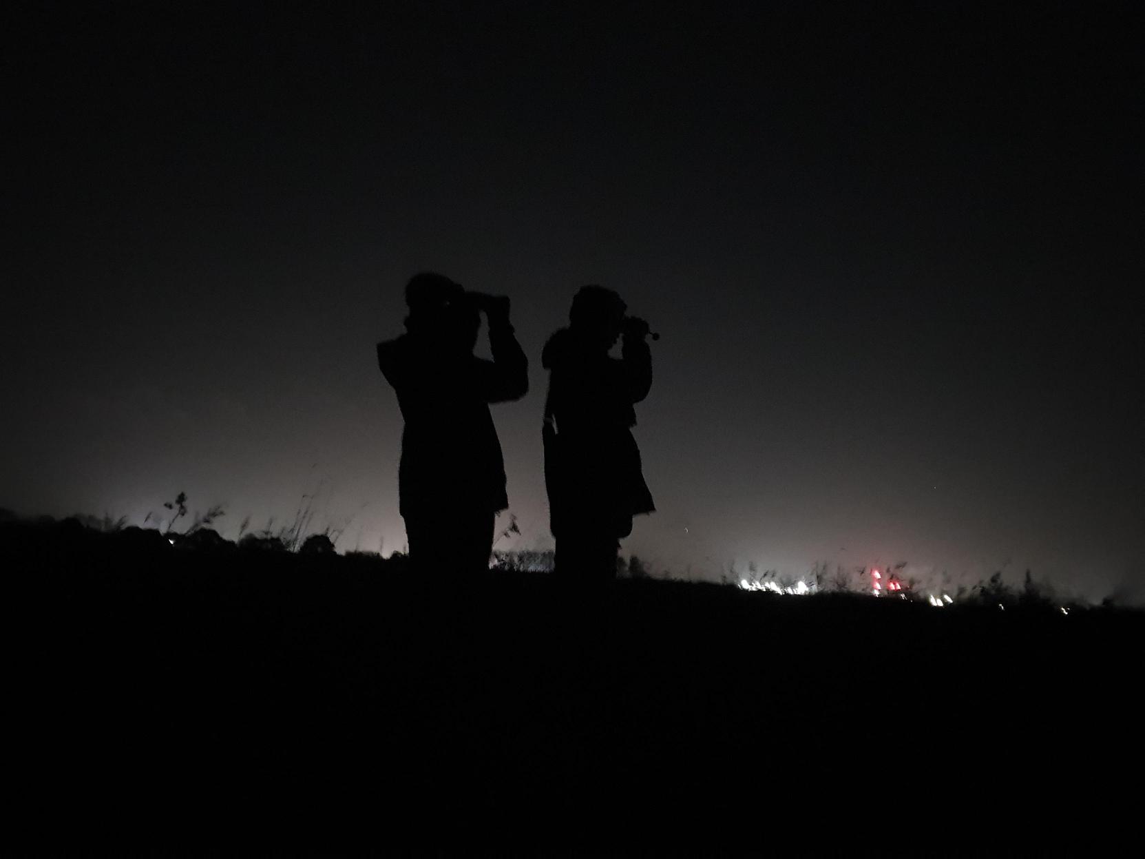 2 people using thermal imaging equipment 