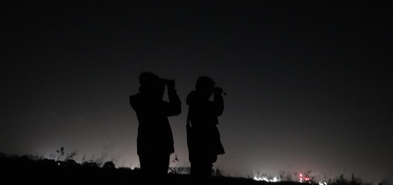 2 people using thermal imaging equipment
