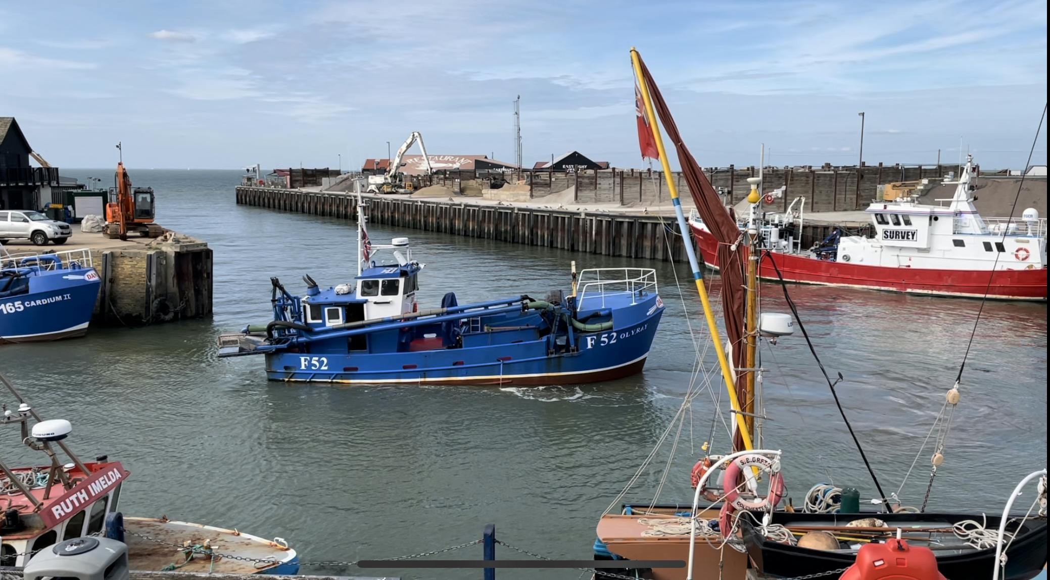 A cockle vessel and other boats in Whitstable harbour