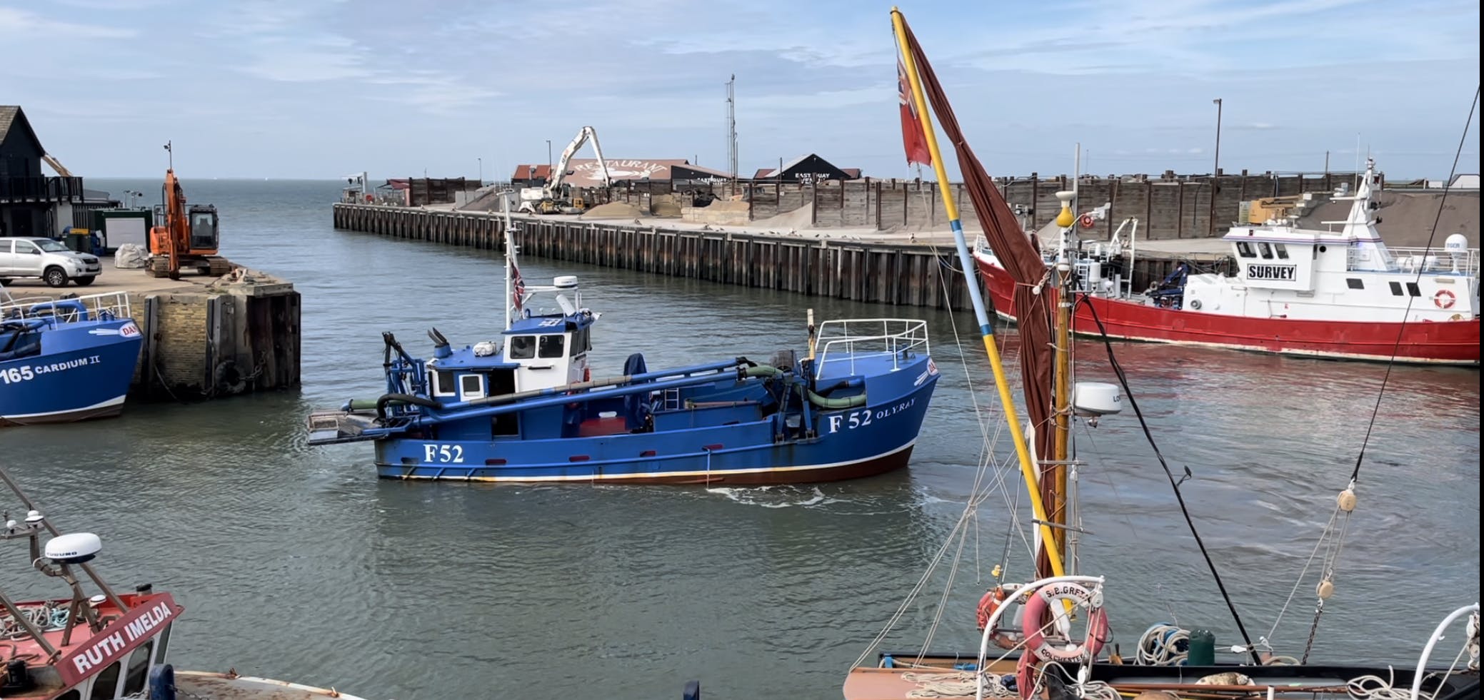 A cockle vessel and other boats in Whitstable harbour
