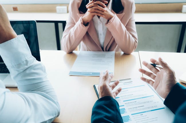 three people at a job interview