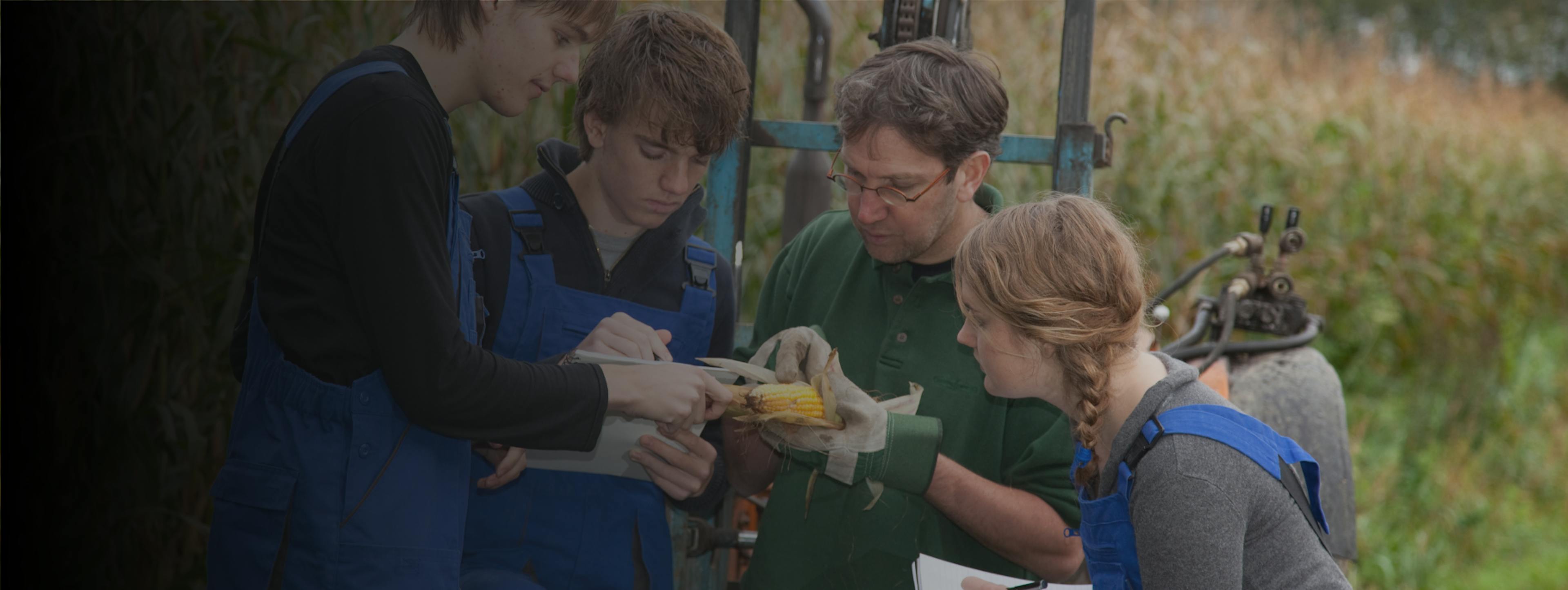 Trainer and students on a farm