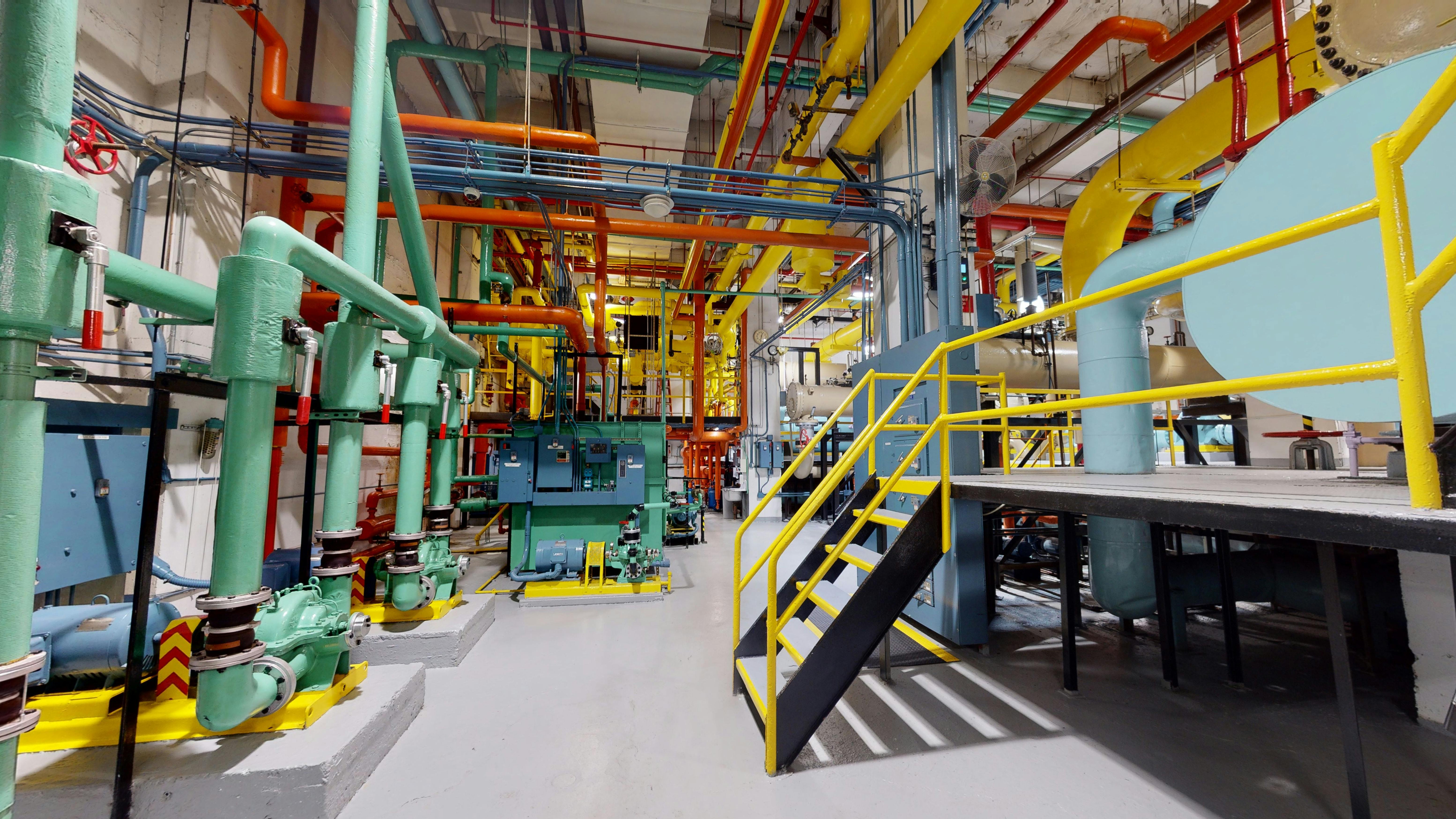 A clean and colorful engine room of a large skyscraper is visibly captured and displayed with Aetos Operate.