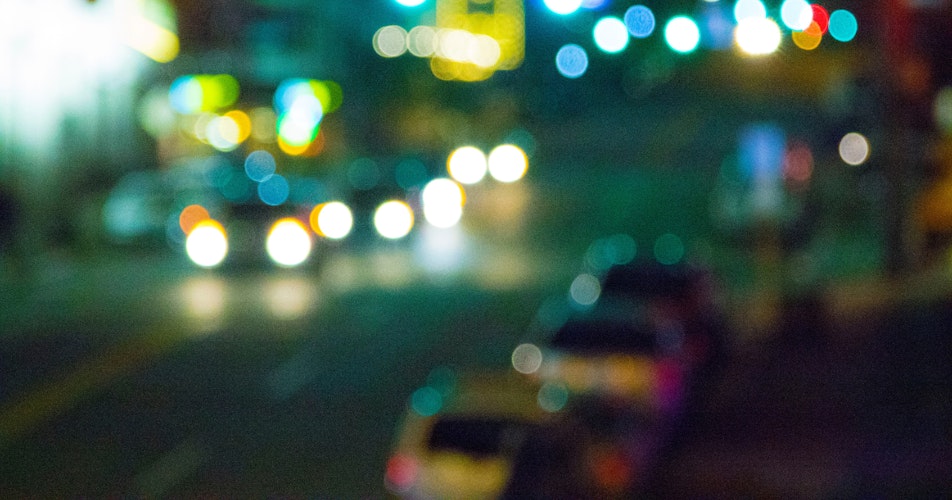 Blurry image of a city street in the dark