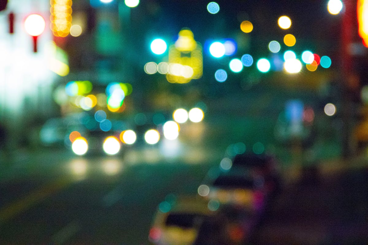 blurry image of a city street at night