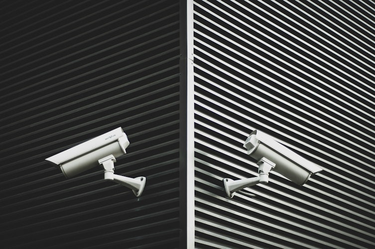 Two security cameras on a building