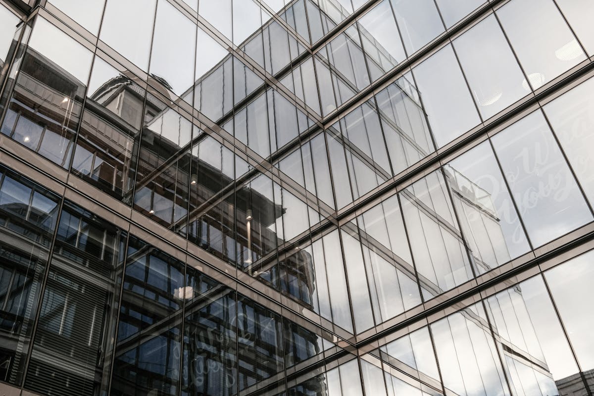 Glass building with reflections of other buildings