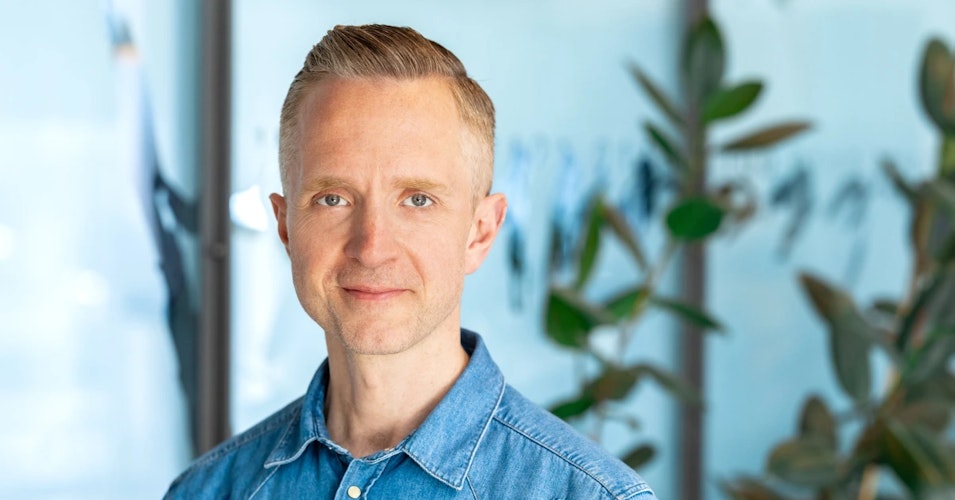 Portrait of middle aged man in a denim shirt