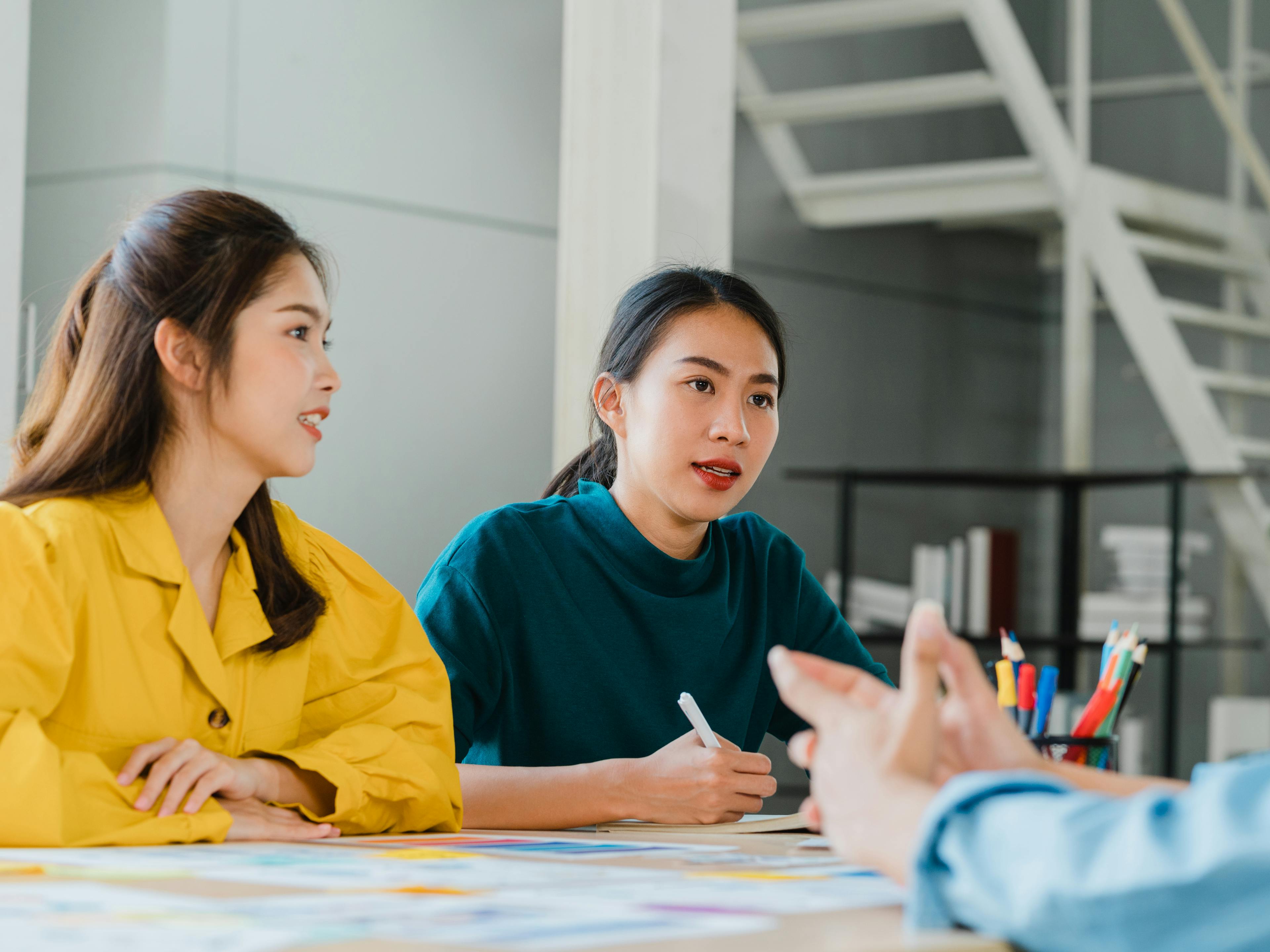 Photo of women in a discussion with clients
