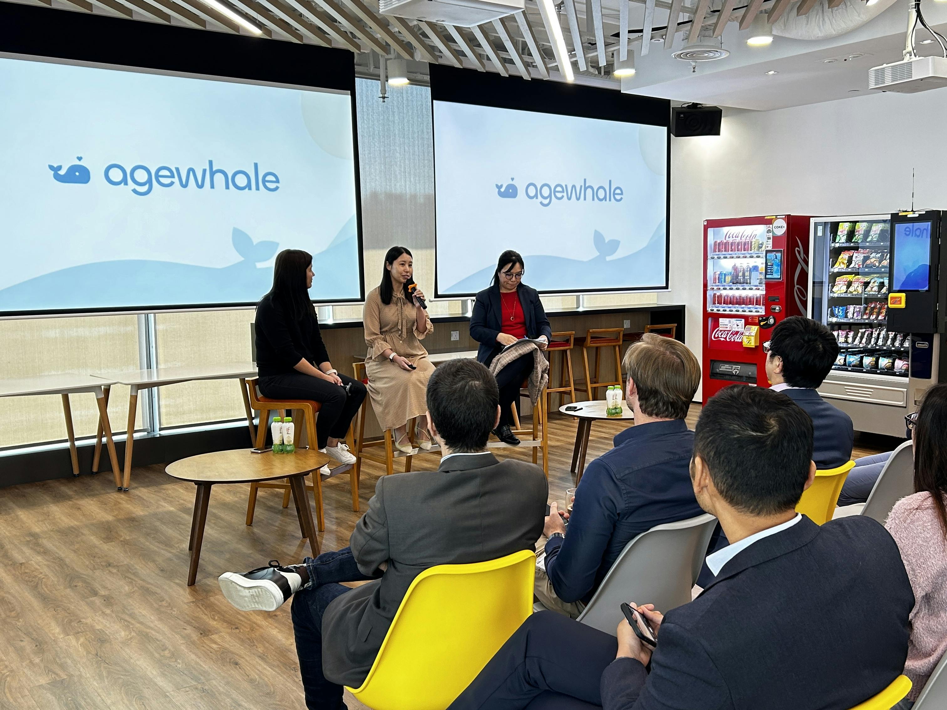 Photo of Agewhale founder Grace giving a talk in a corporation