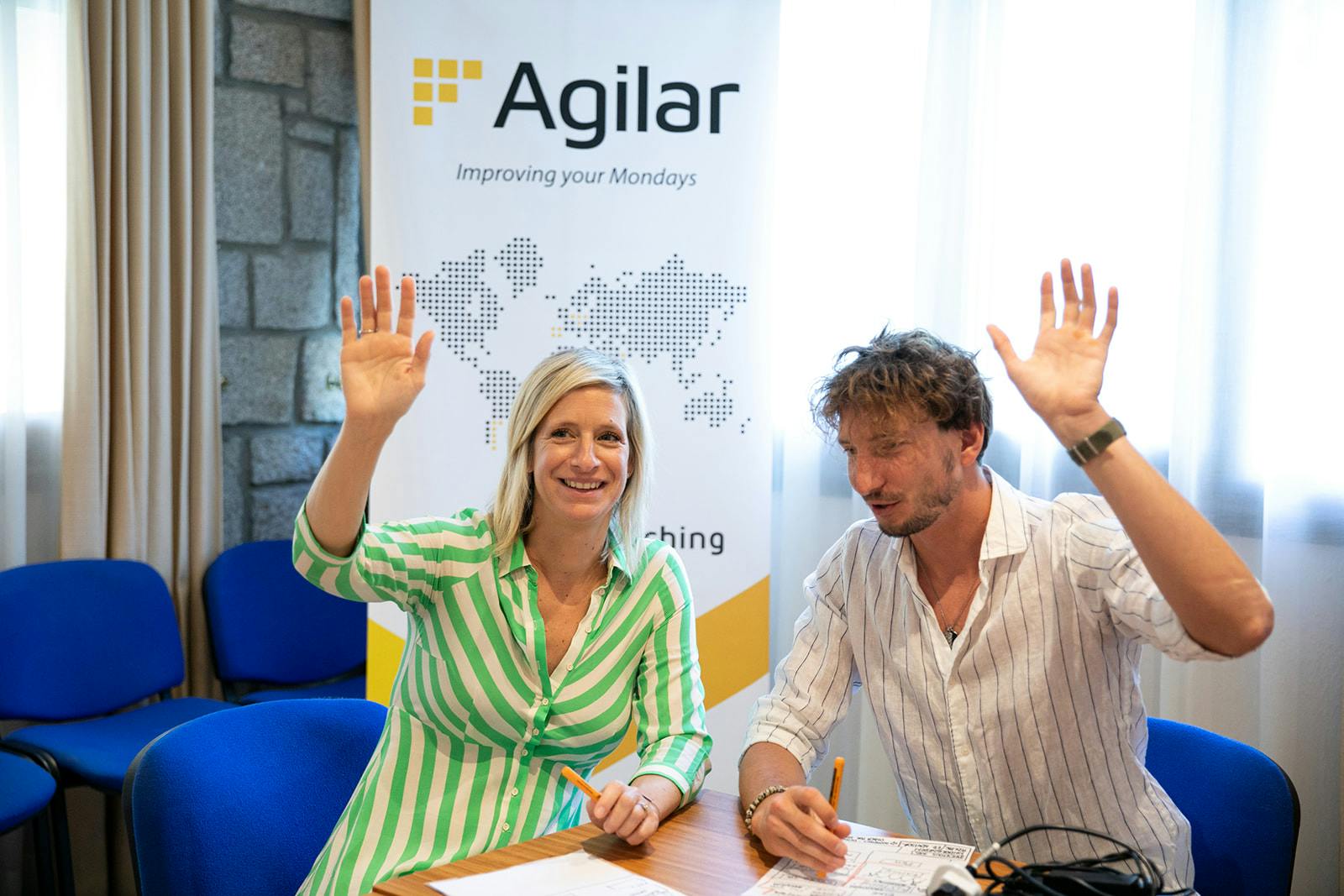 Two people lifting their hands