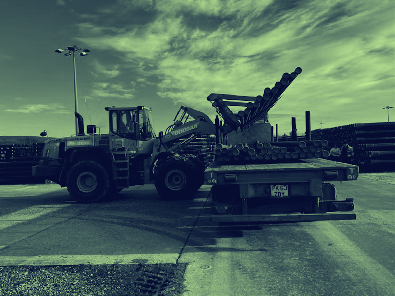 industrial machinery loaded on flatbed lorry