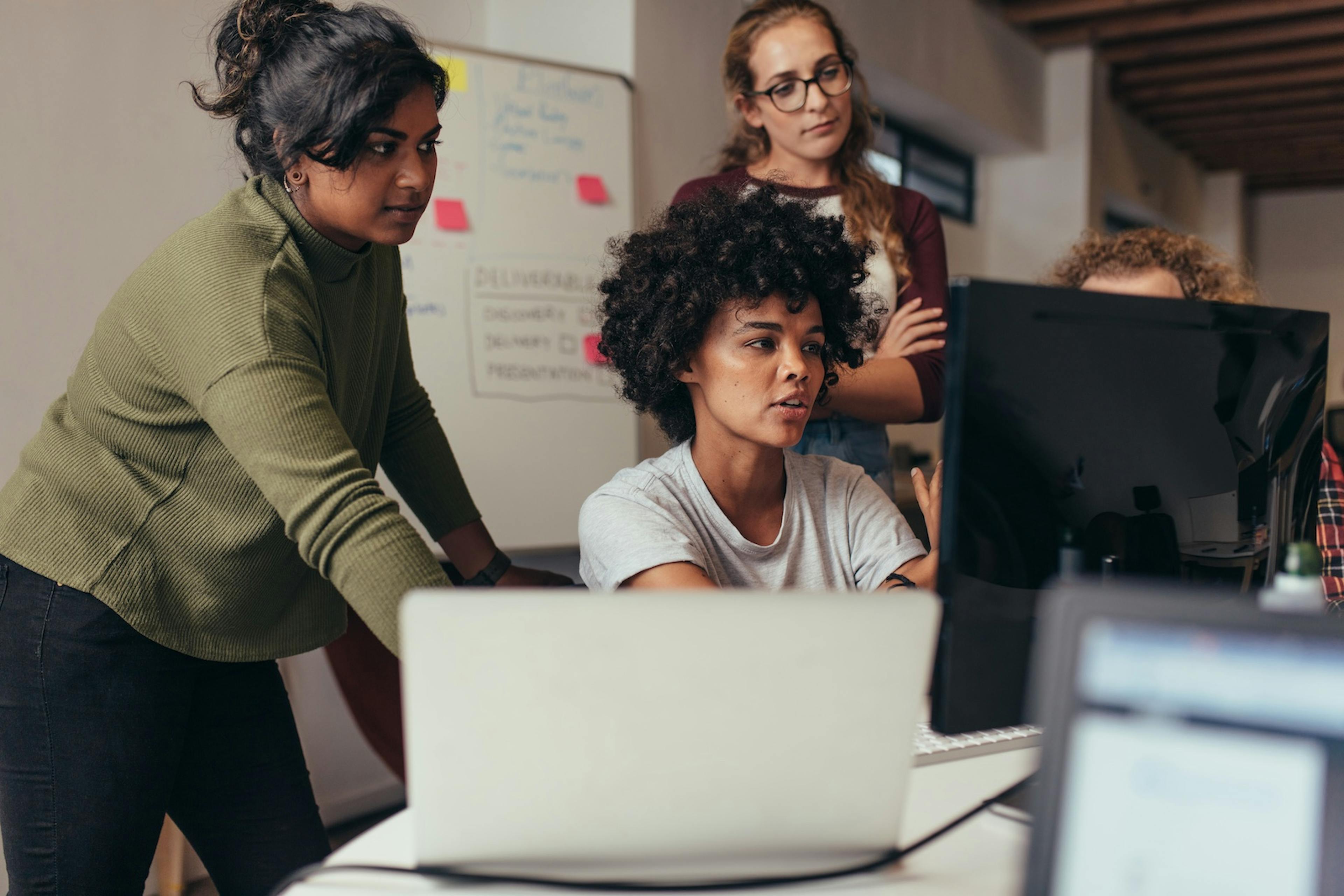 Software engineers working on project together