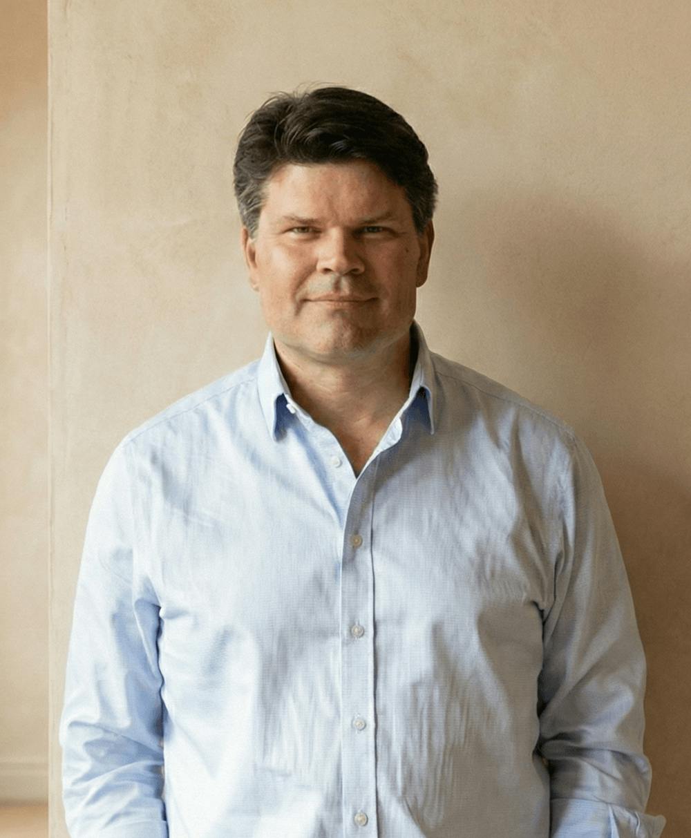 Jens Lapinski - white man with a blue shirt