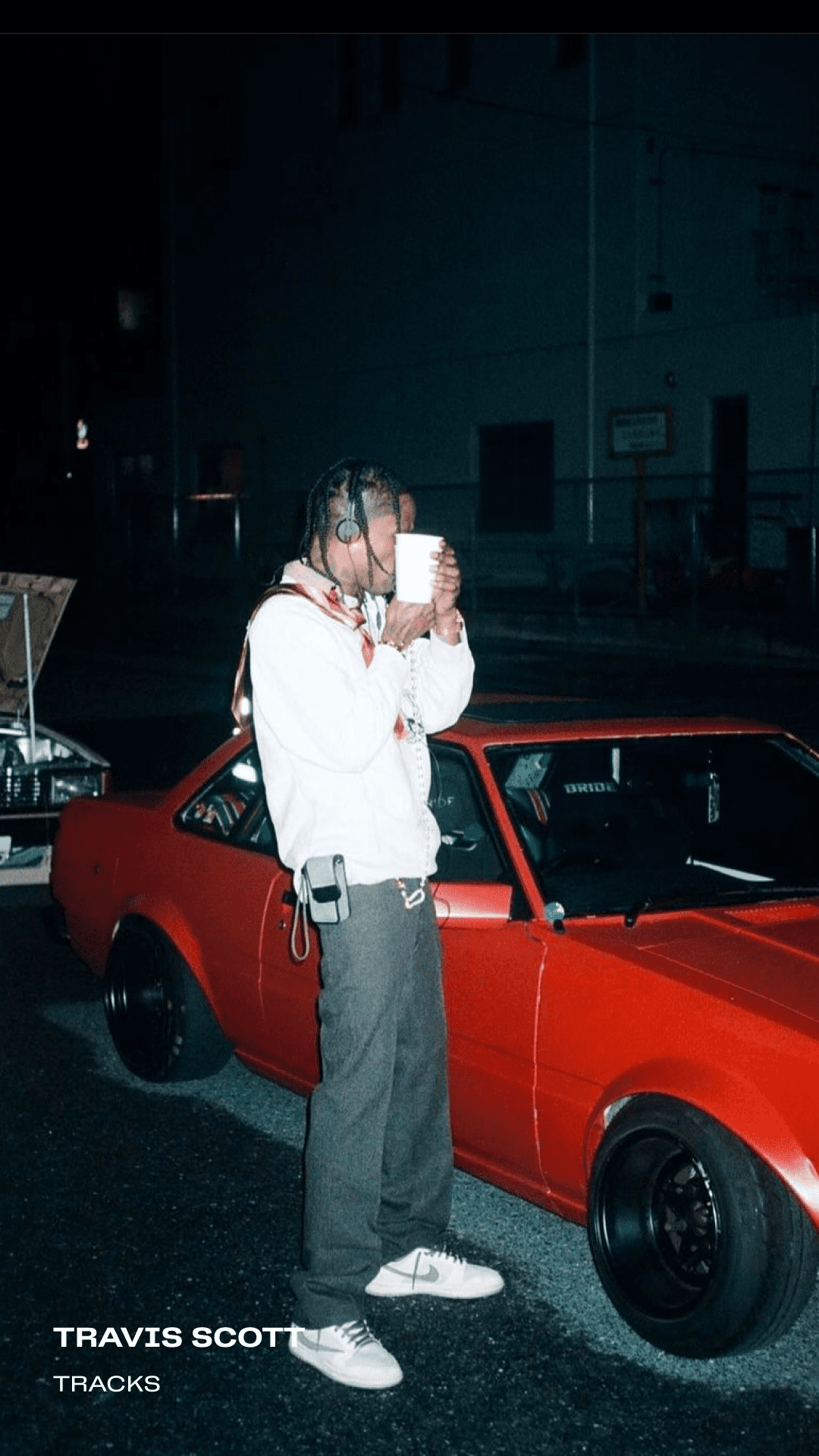 Travis scott wearing AIAIAI tracks headphones