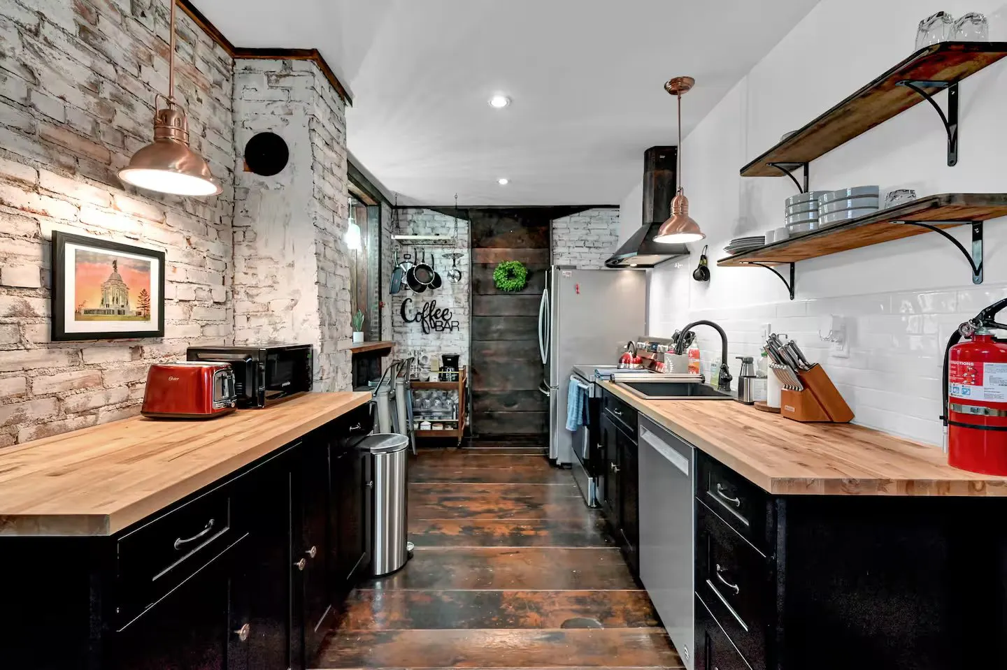 Kitchen of the Historic Downtown Home in Gettysburg, Pennsylvania, with exposed brick walls and butcher-block counters
