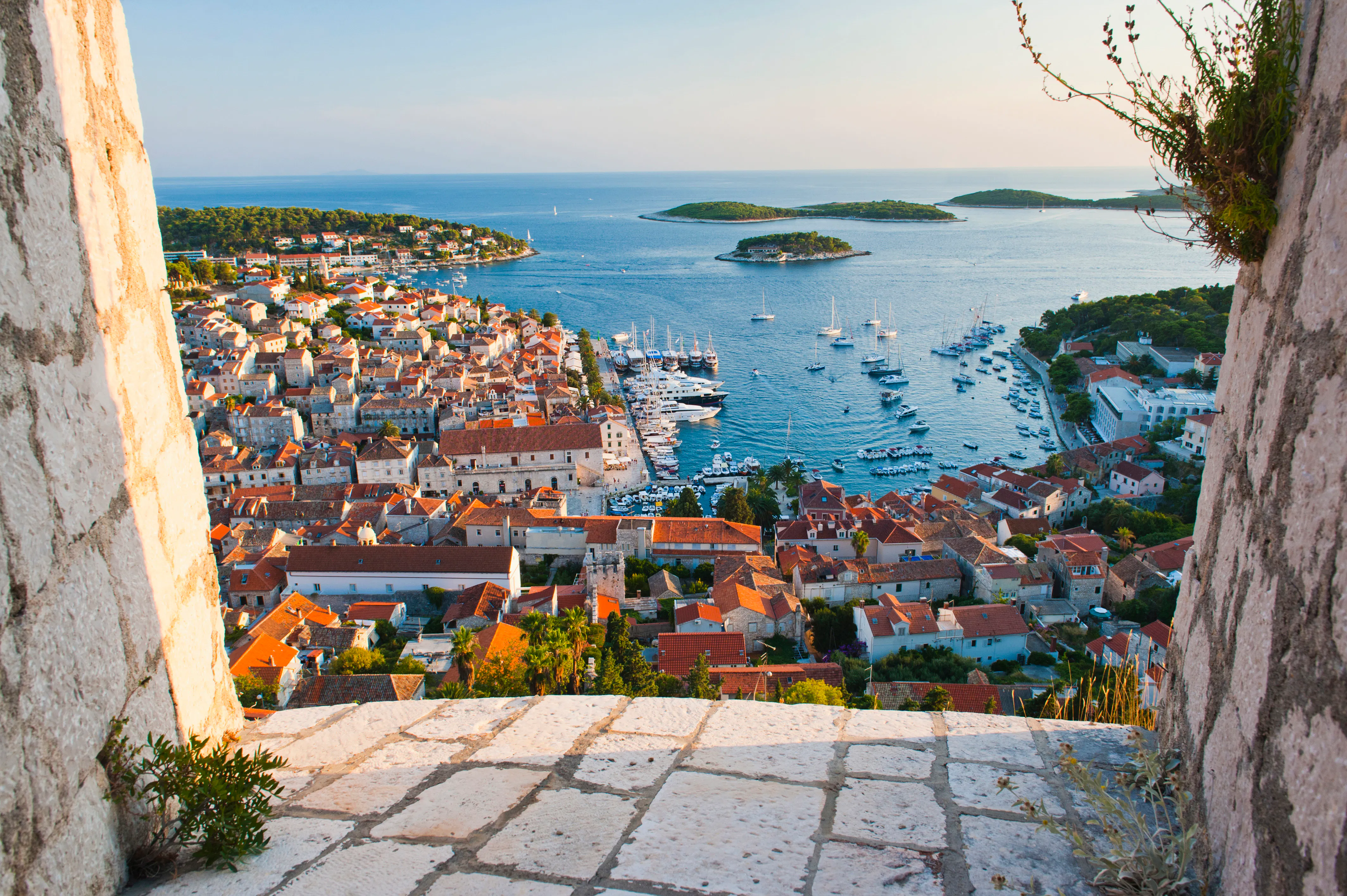 Coastal Cityscape Overlooking Blue Water and Distant Islands