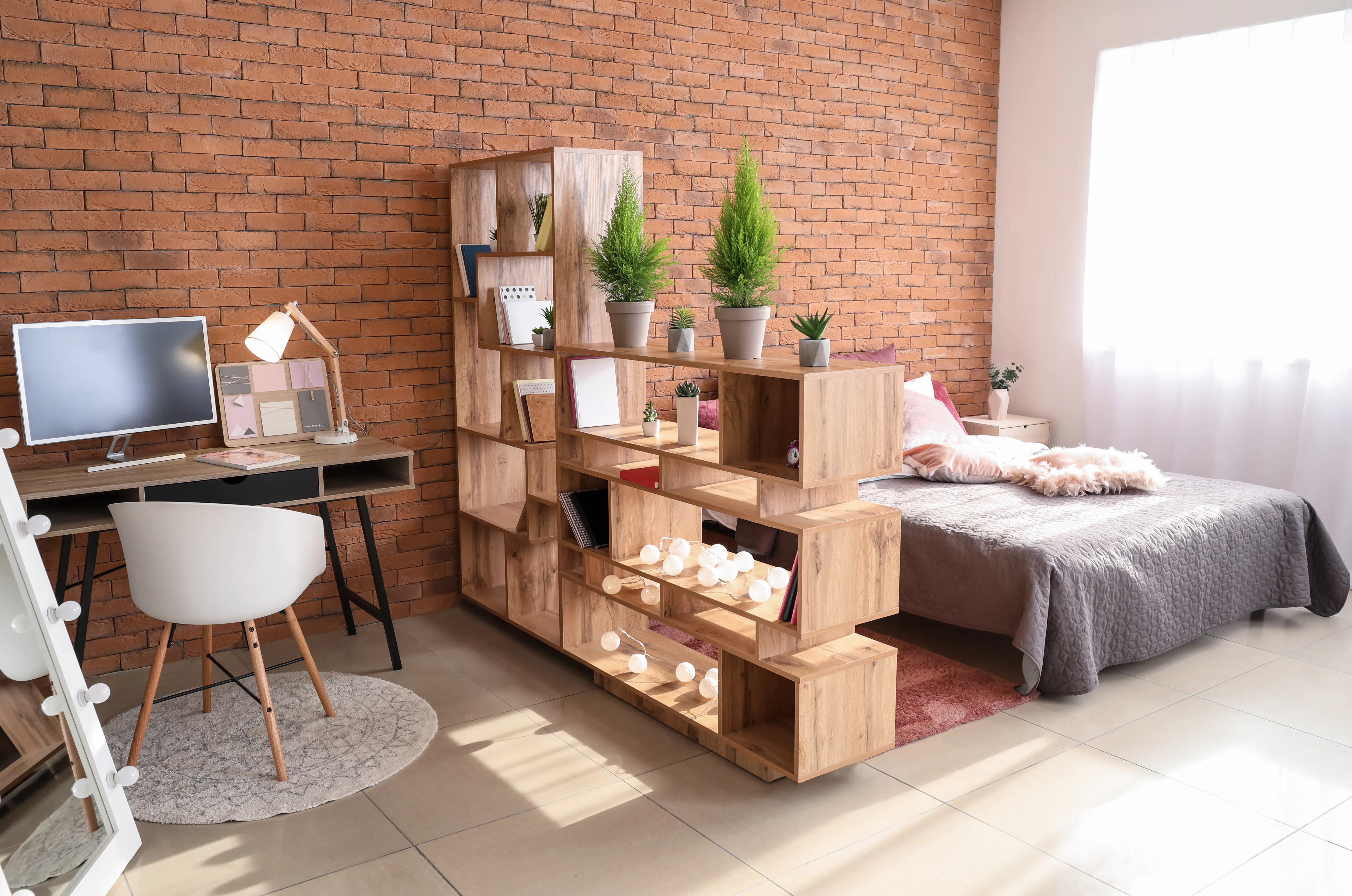 Shelf as room divider in studio apartment