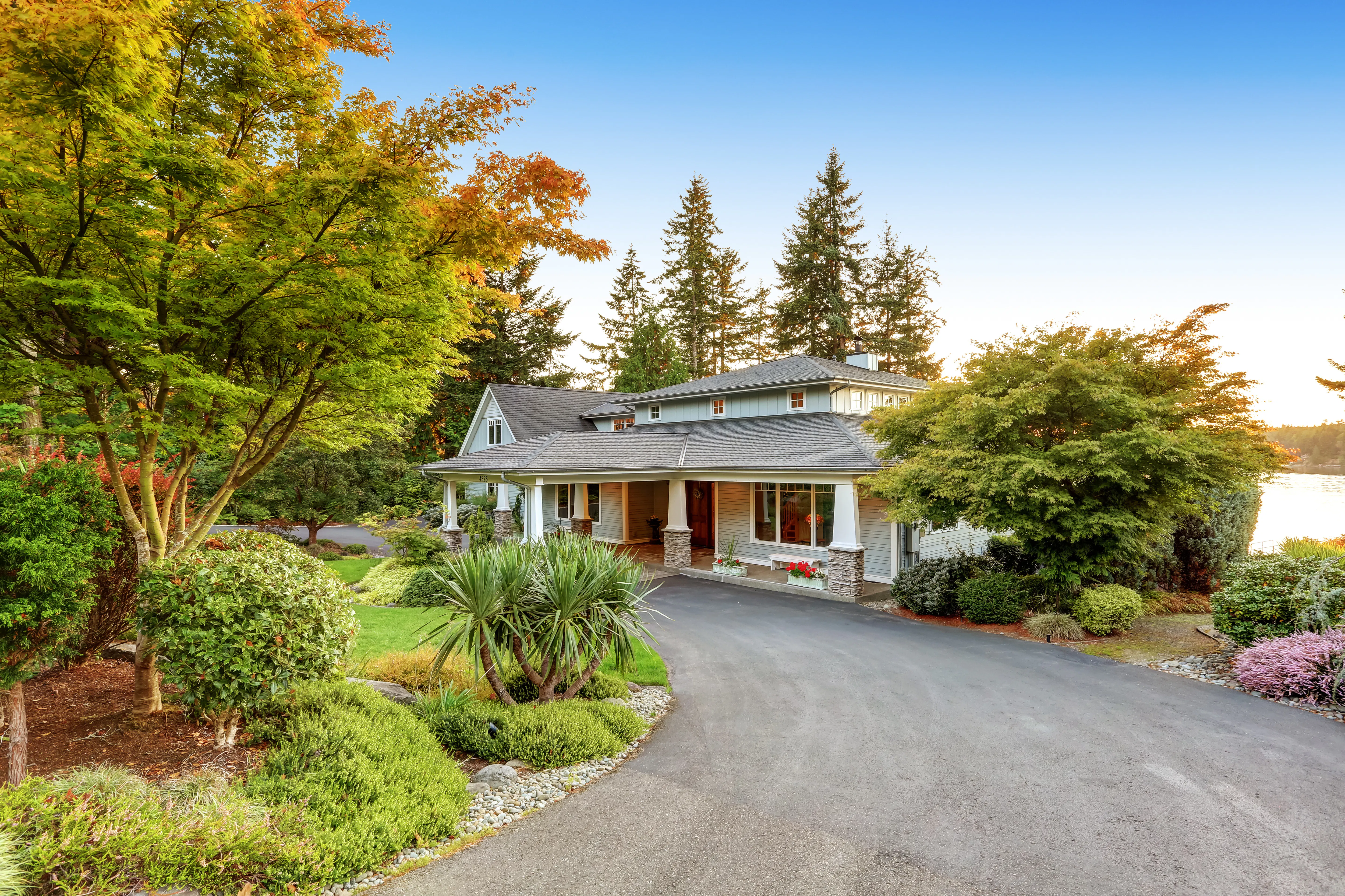 house with long concrete driveway