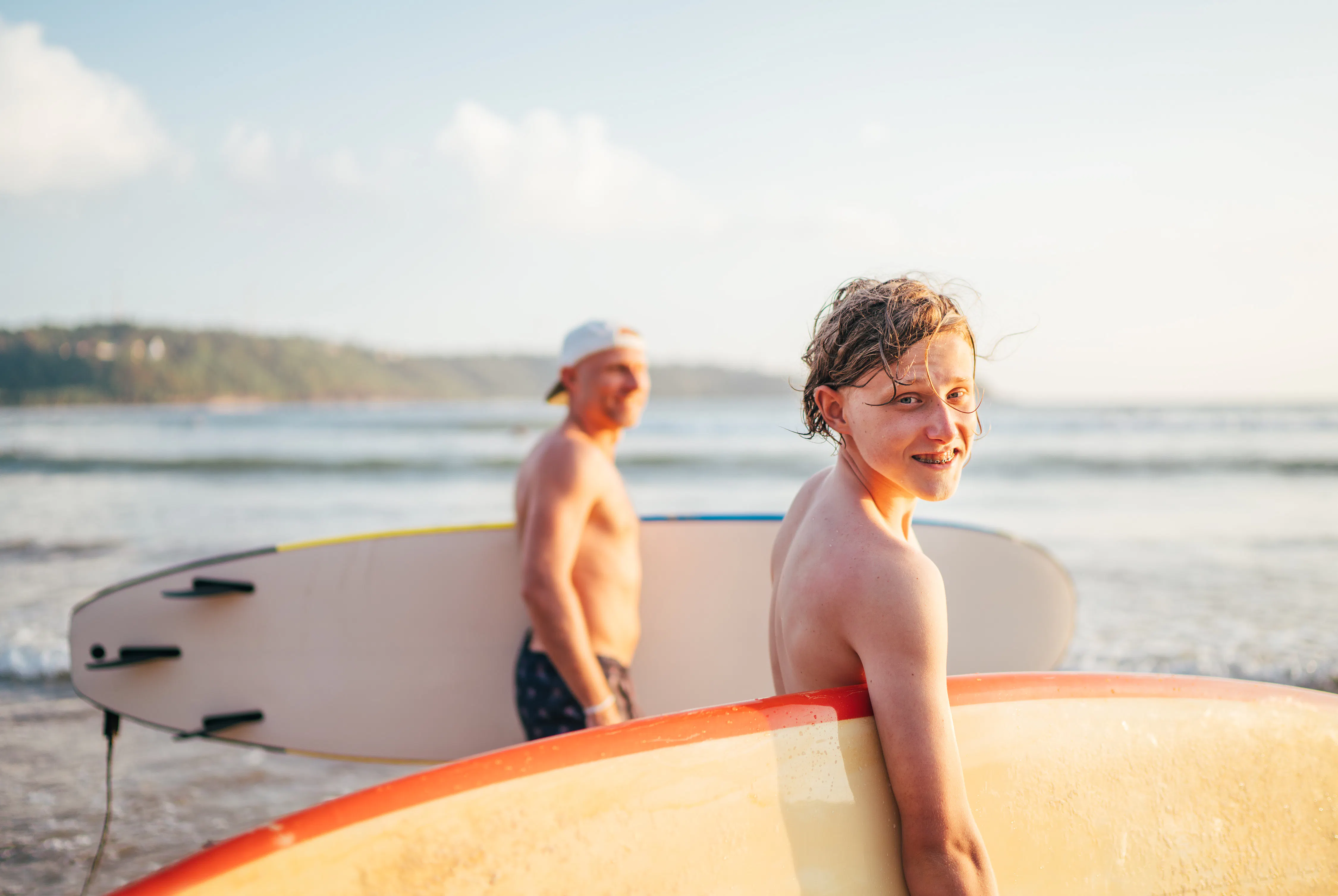 Father and son with surfboards
