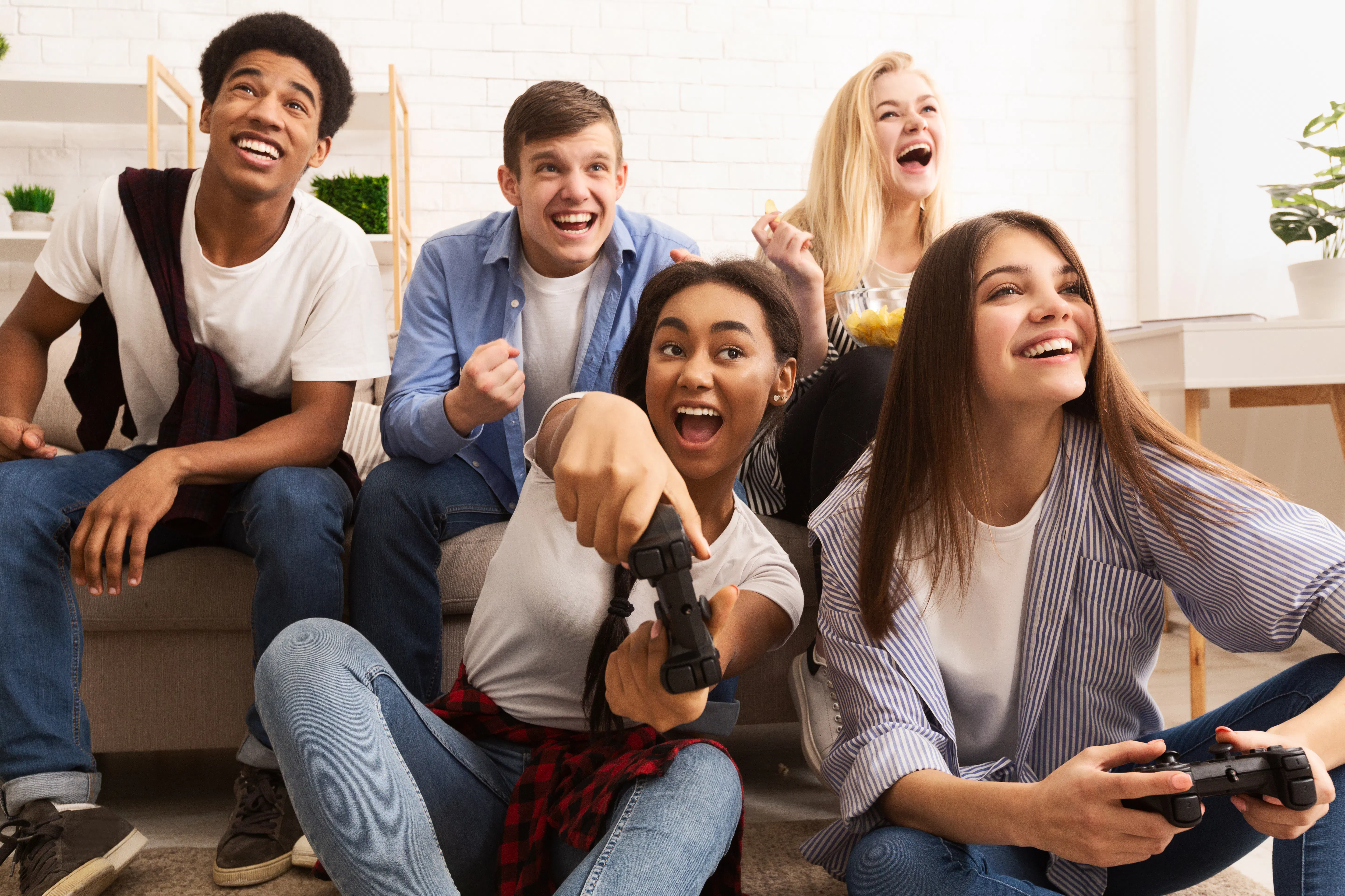 Teenagers playing video games