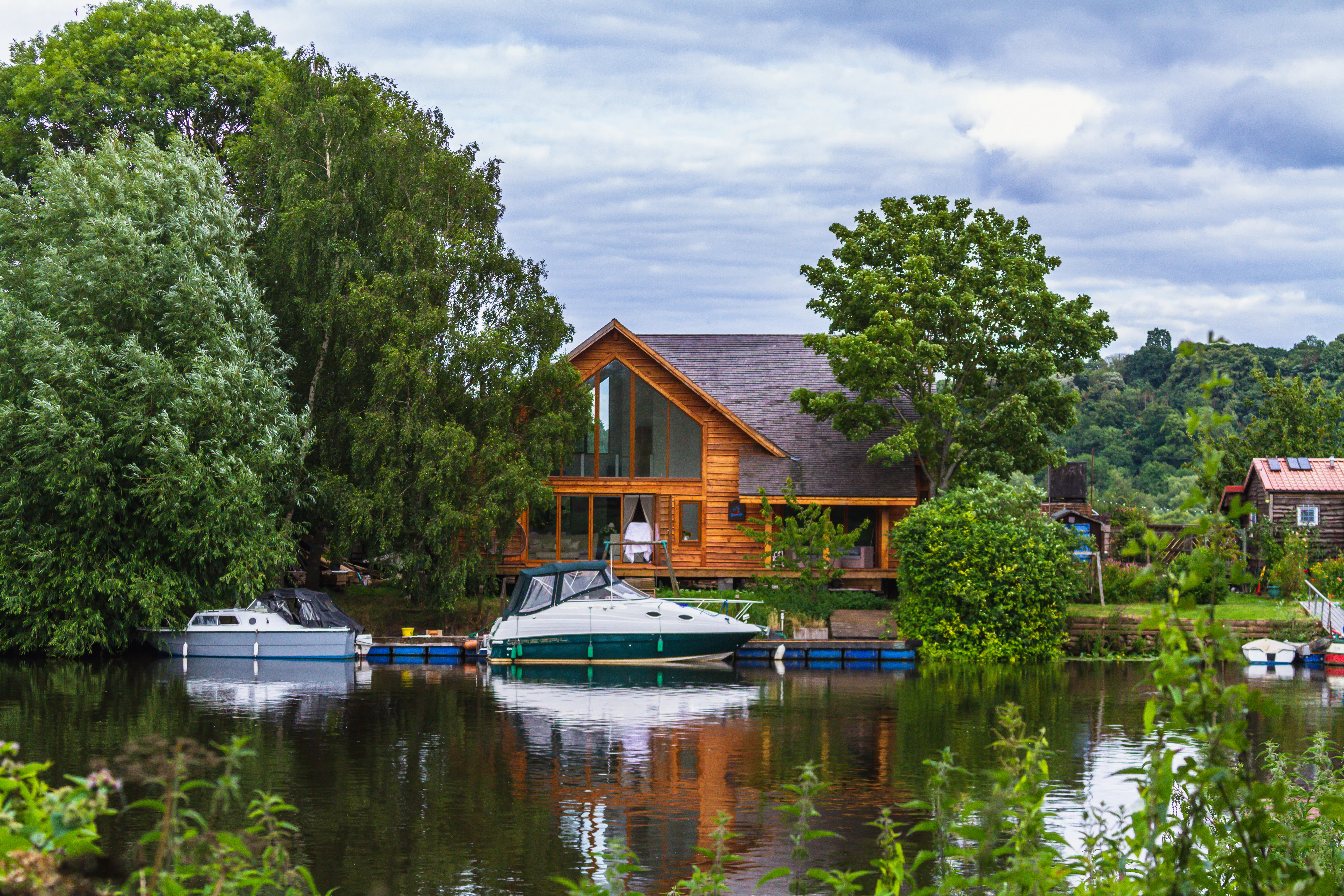 Large house on lake with boats