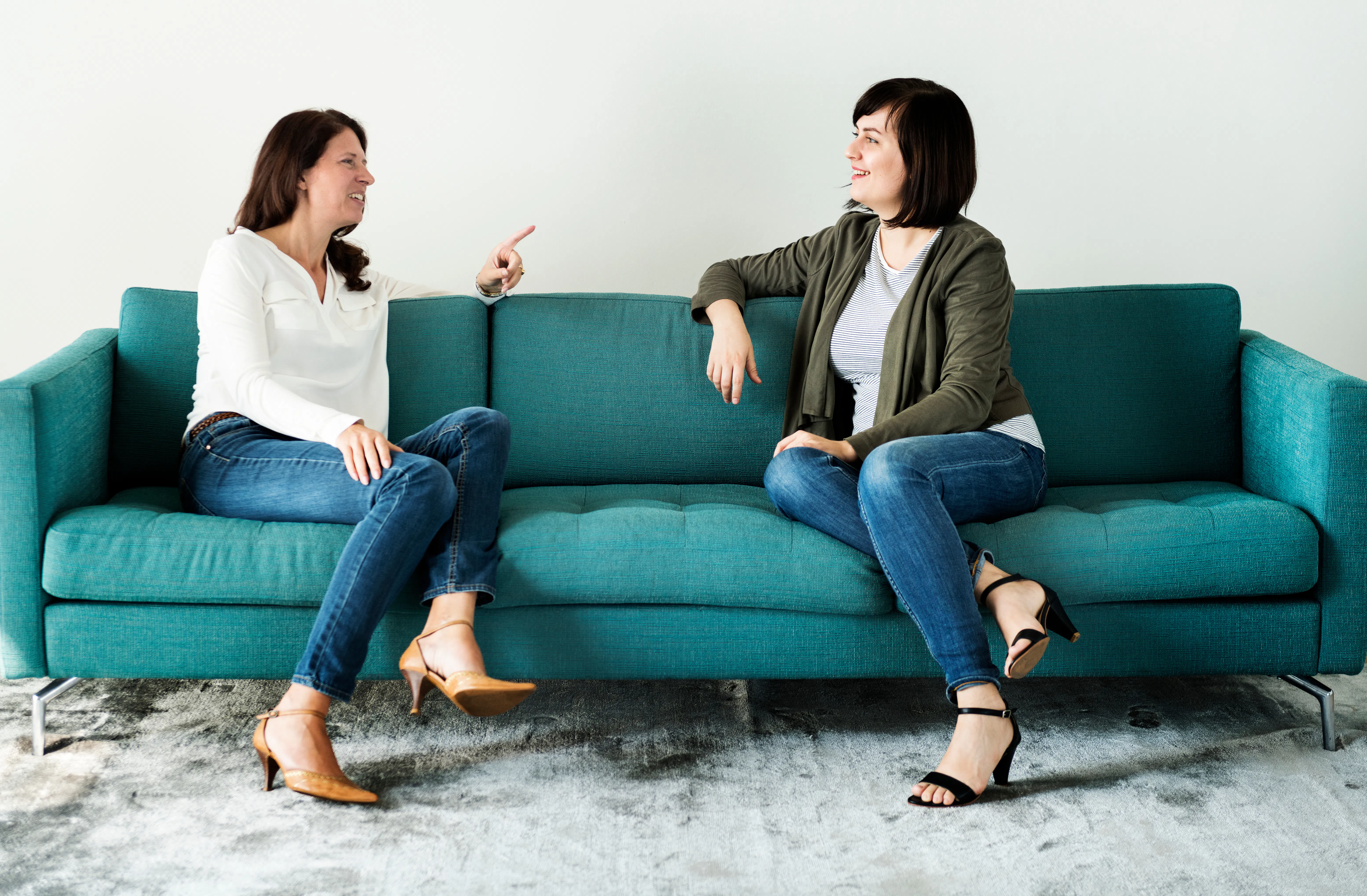 Women talking together on the couch