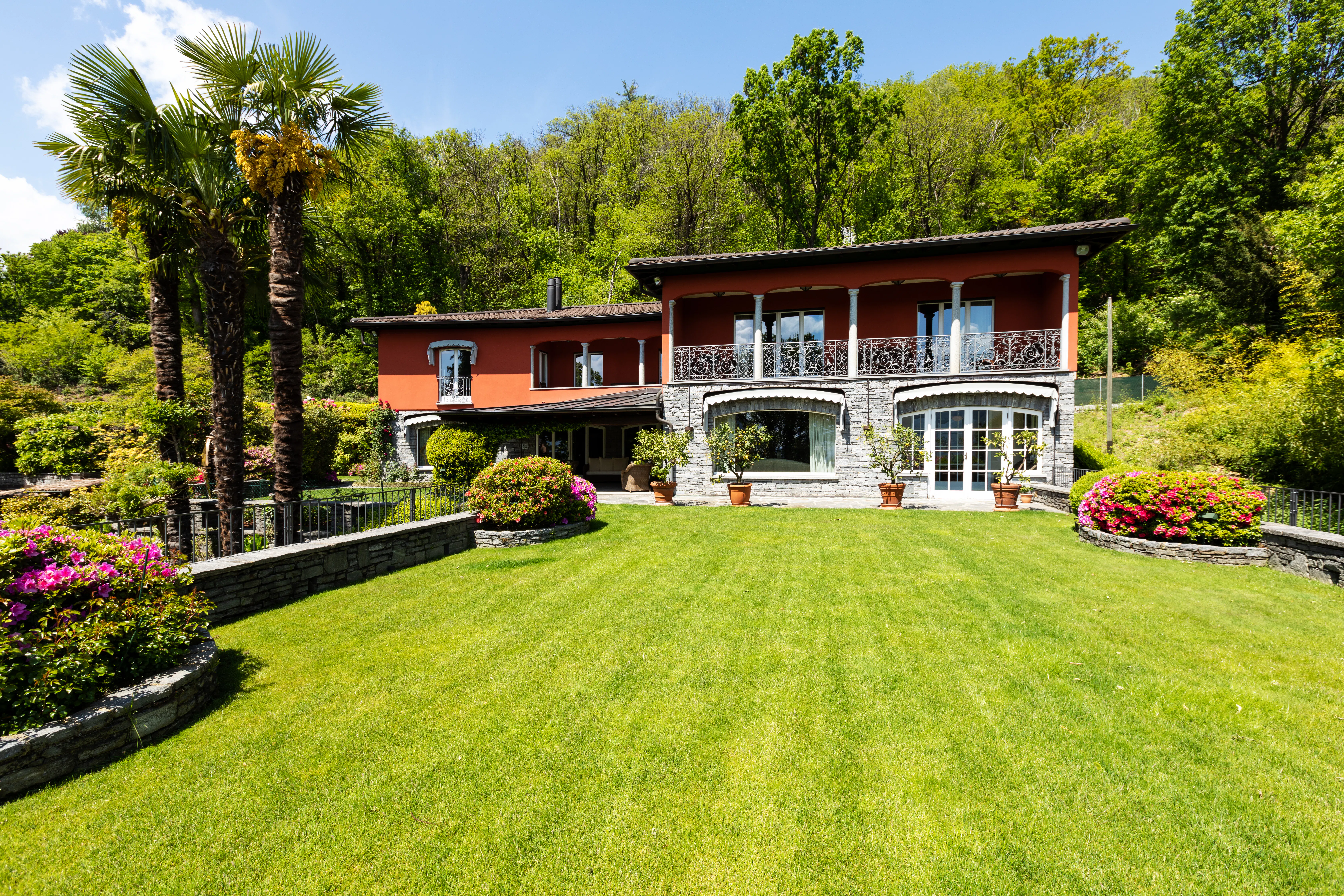Exterior of house with green garden and nature 