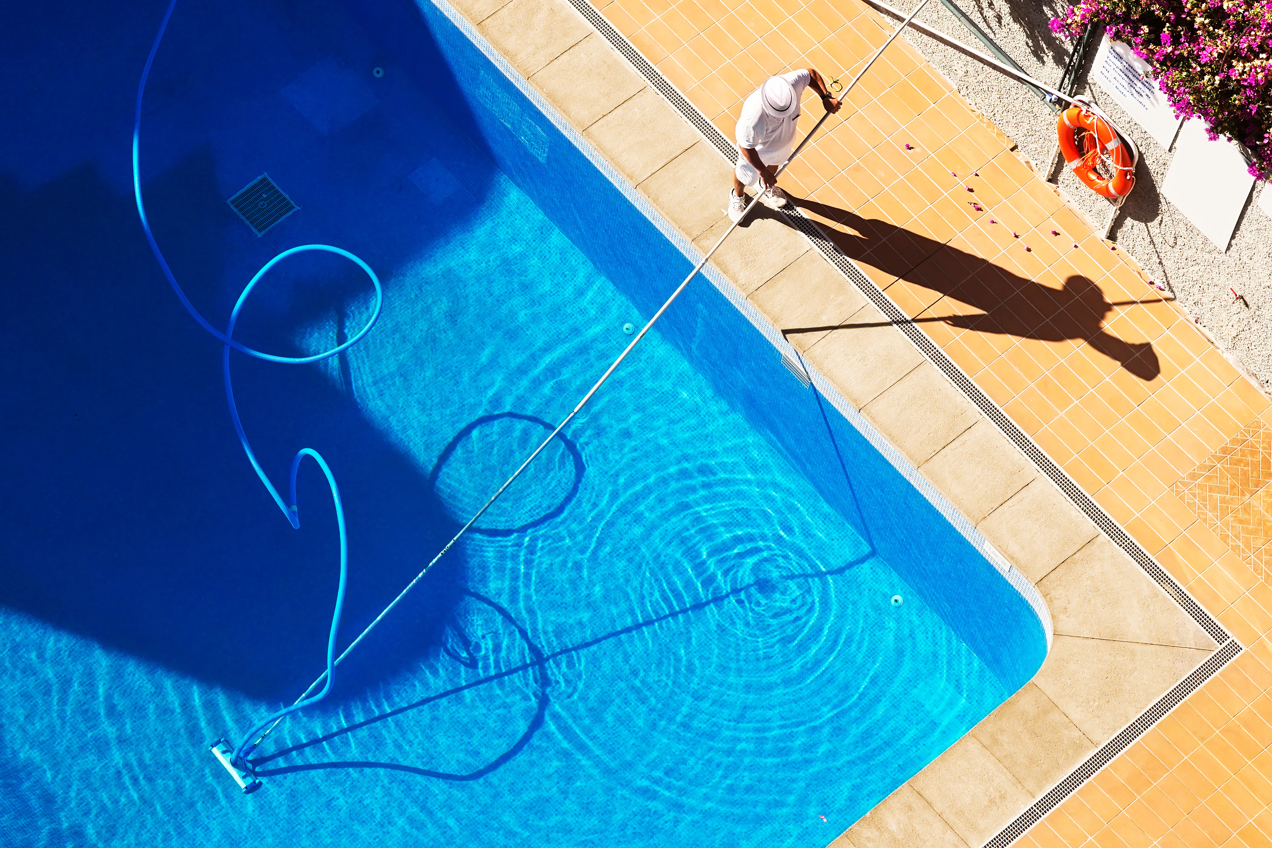 Worker cleaning pool