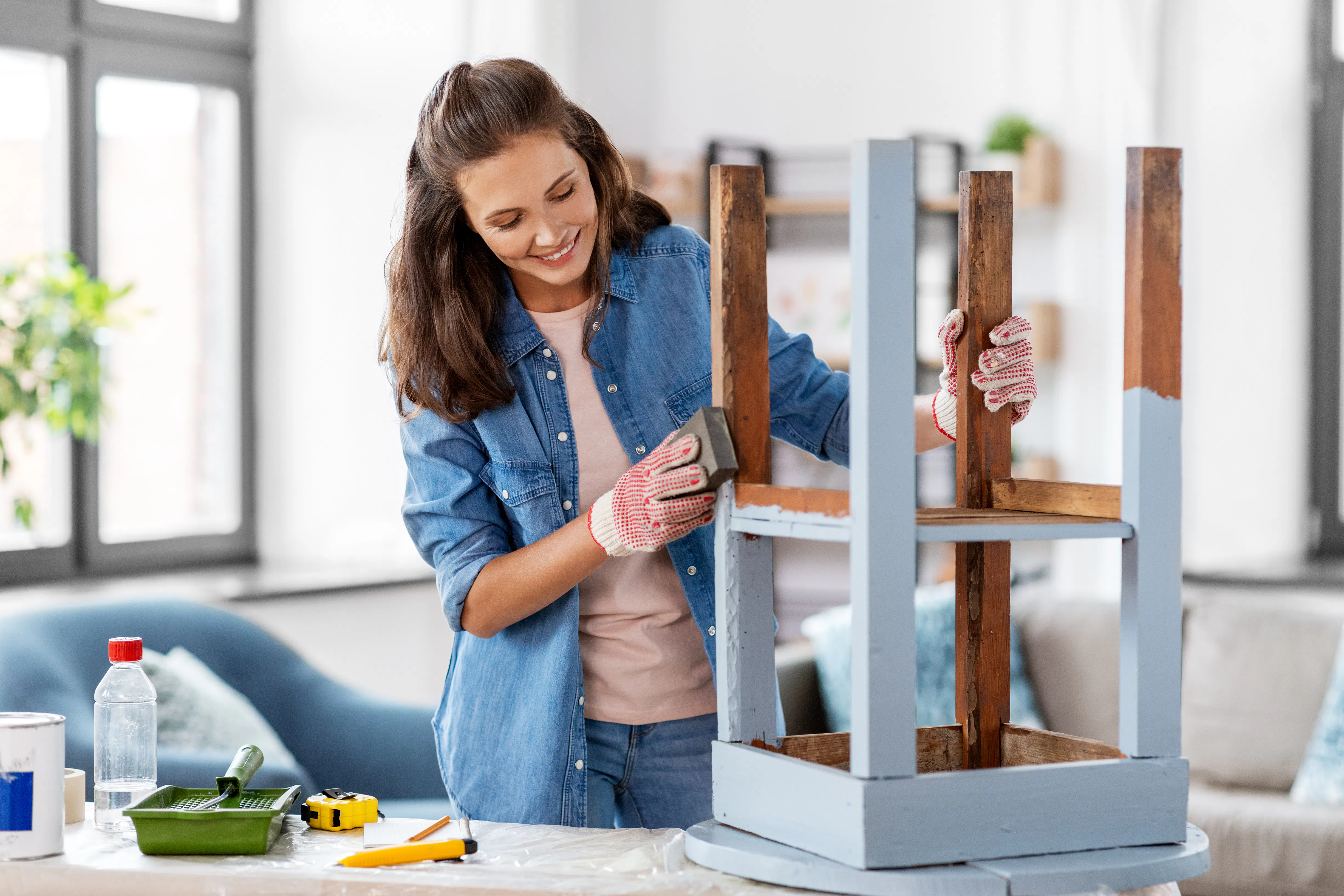 Woman painting stool