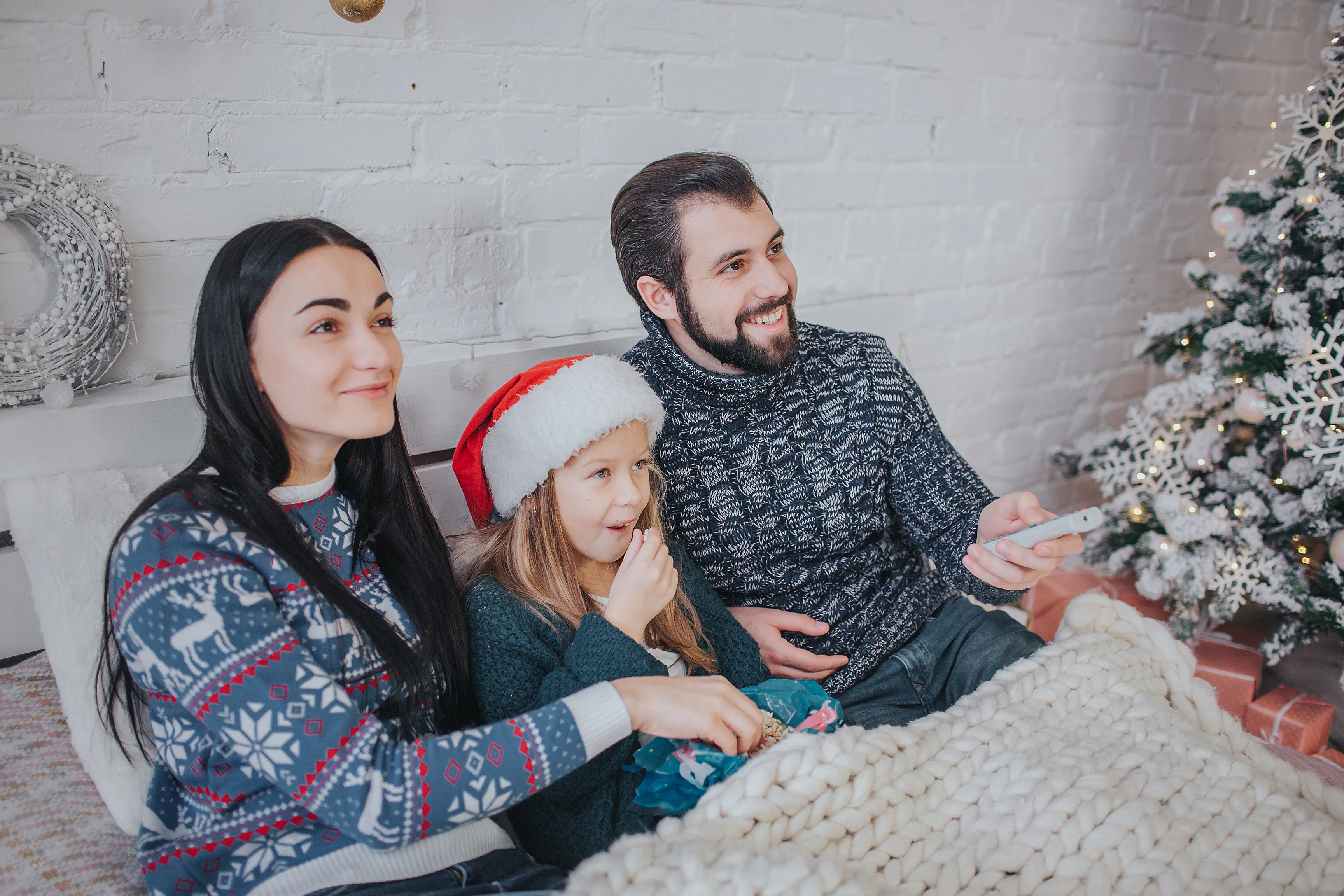 Young family celebrating holiday at home