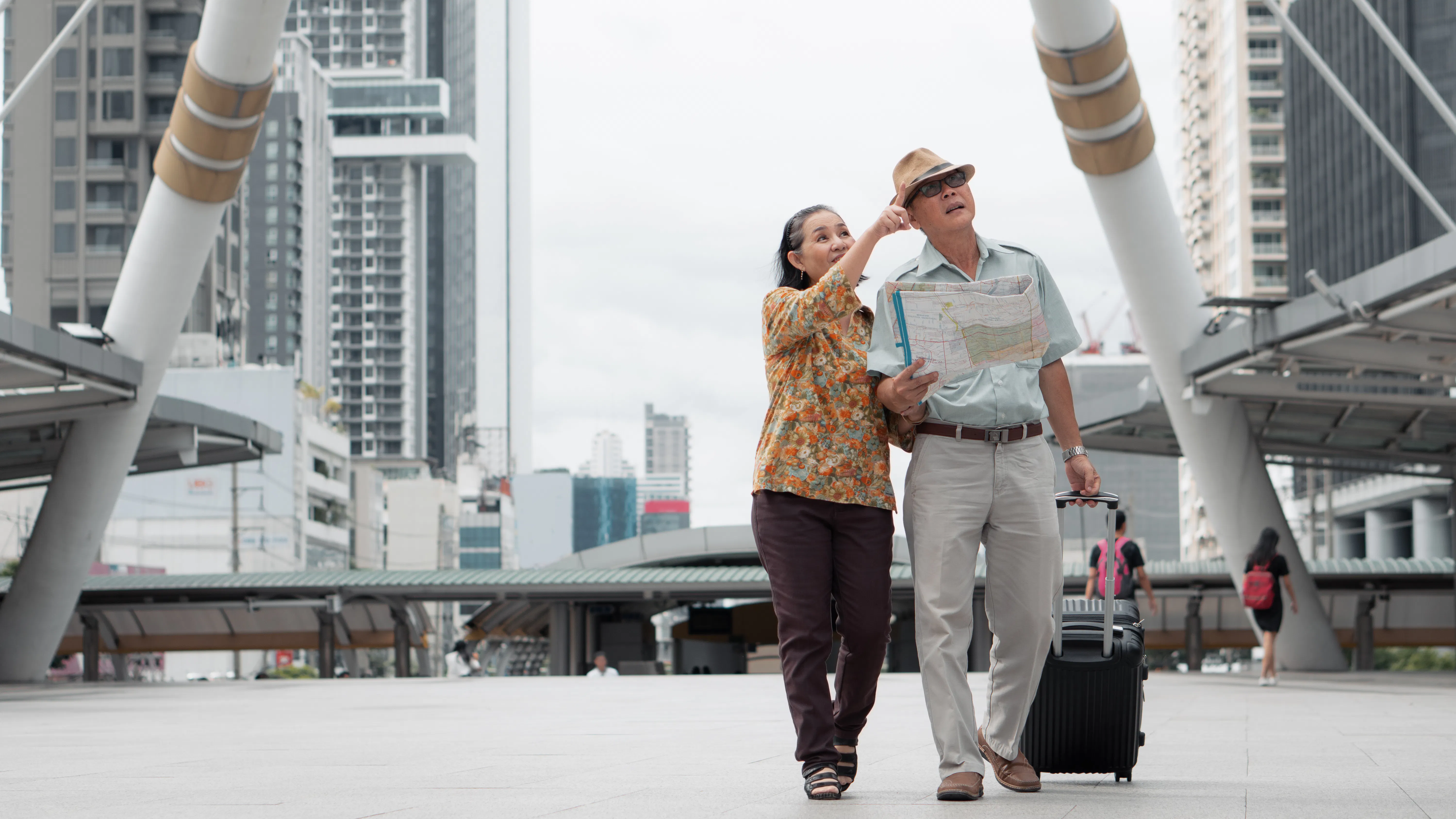 Chinese tourists with map