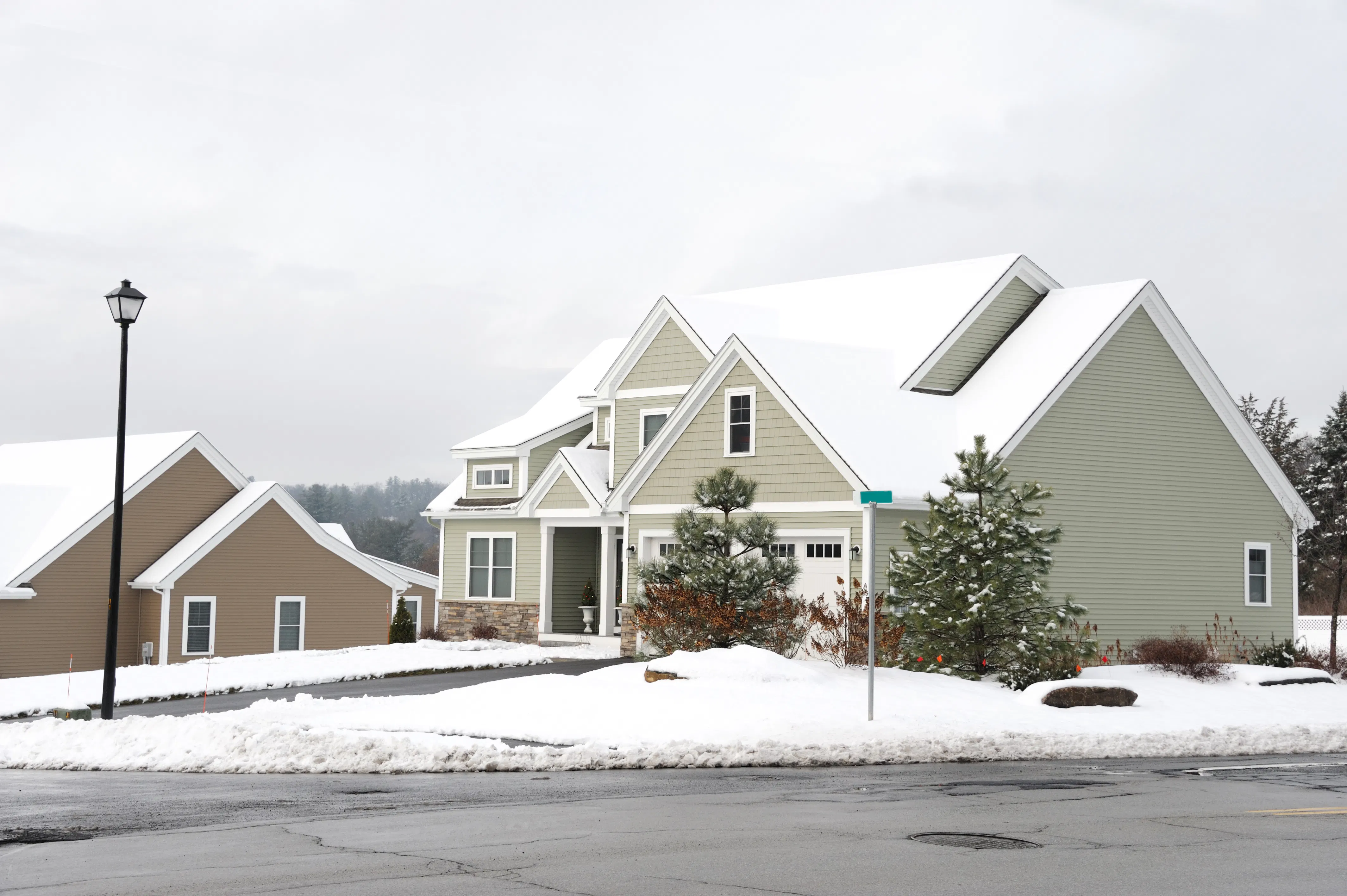 houses in residential community after snow in winter