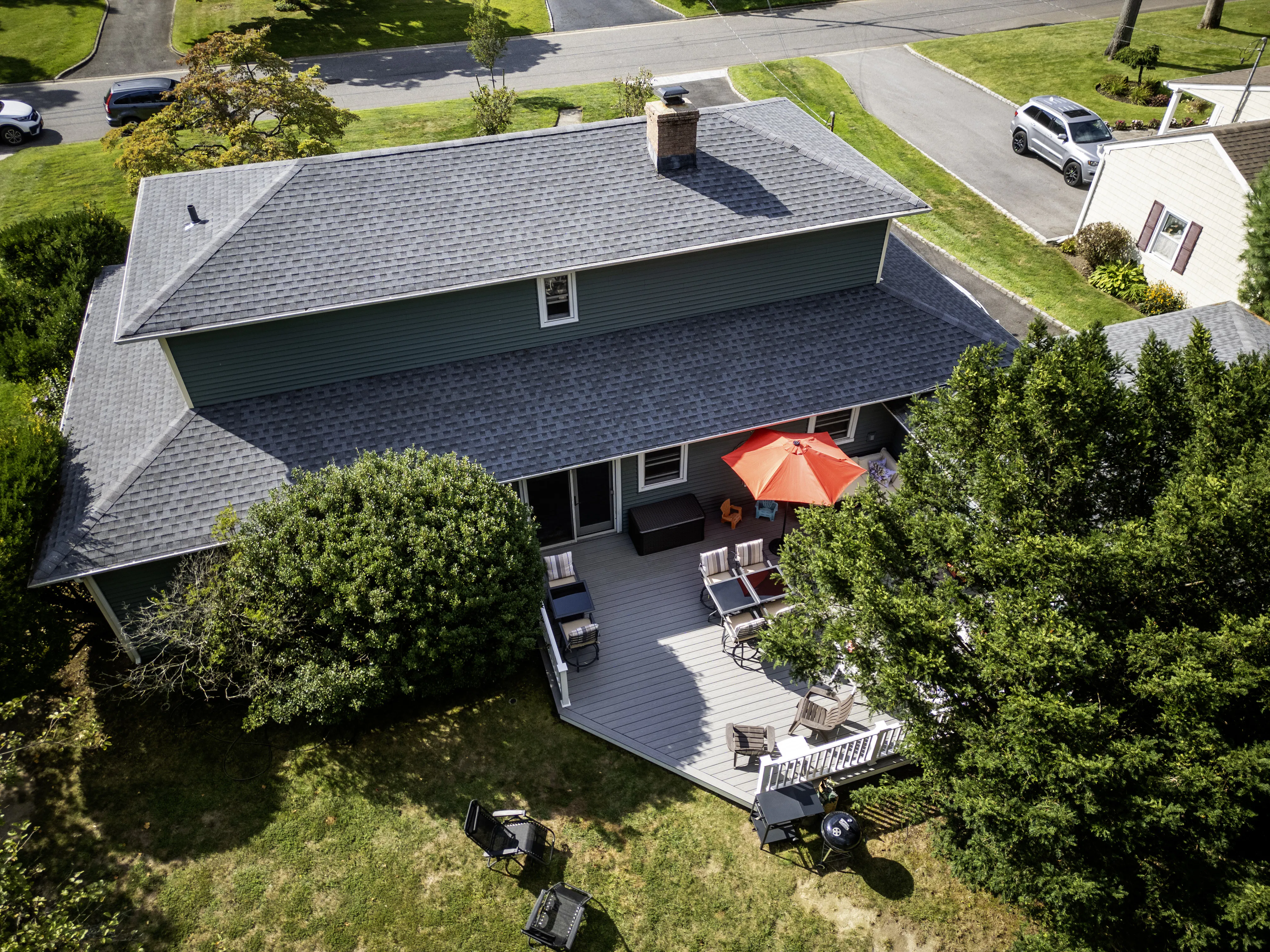Drone view of house with patio