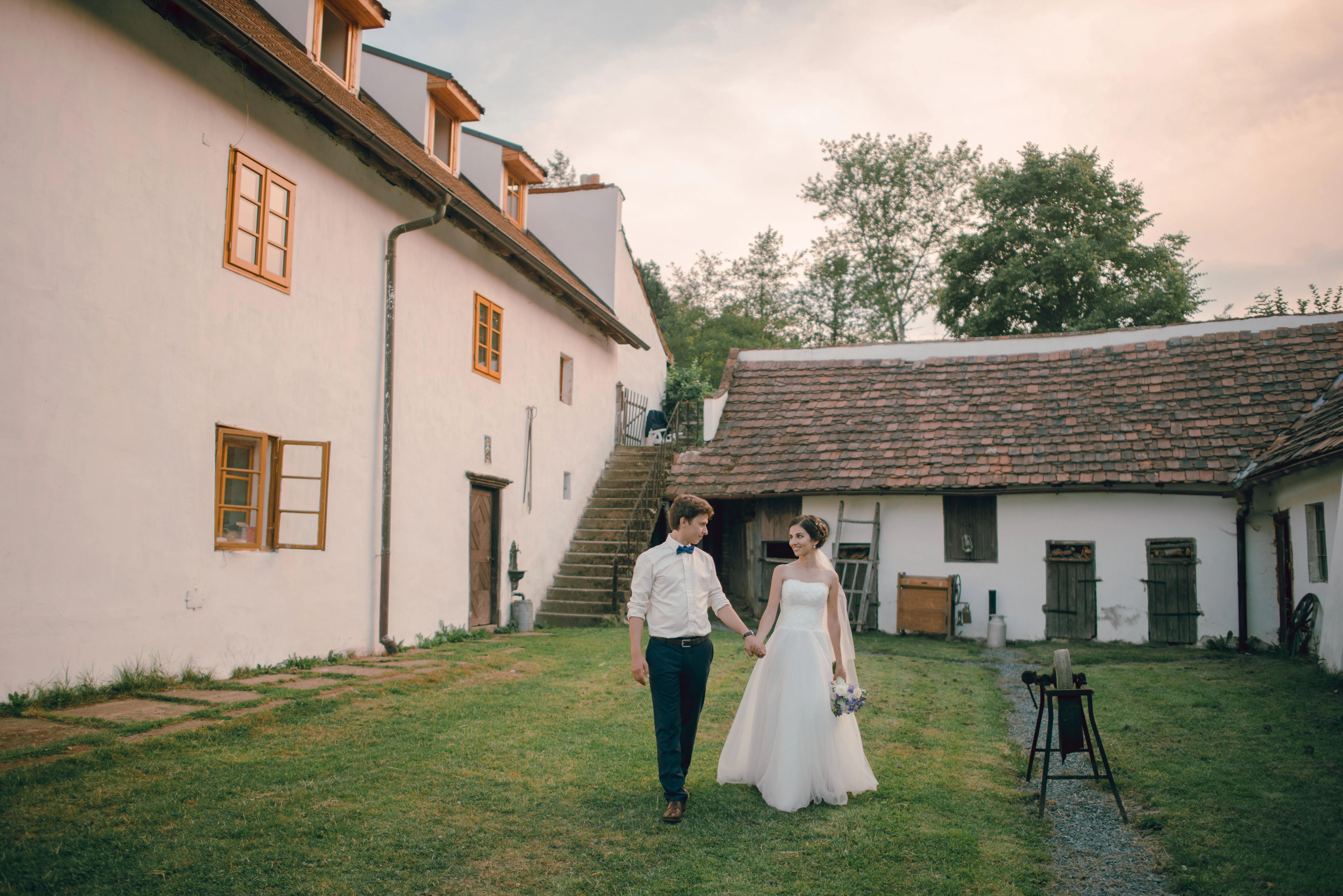 Newlyweds outside of country home