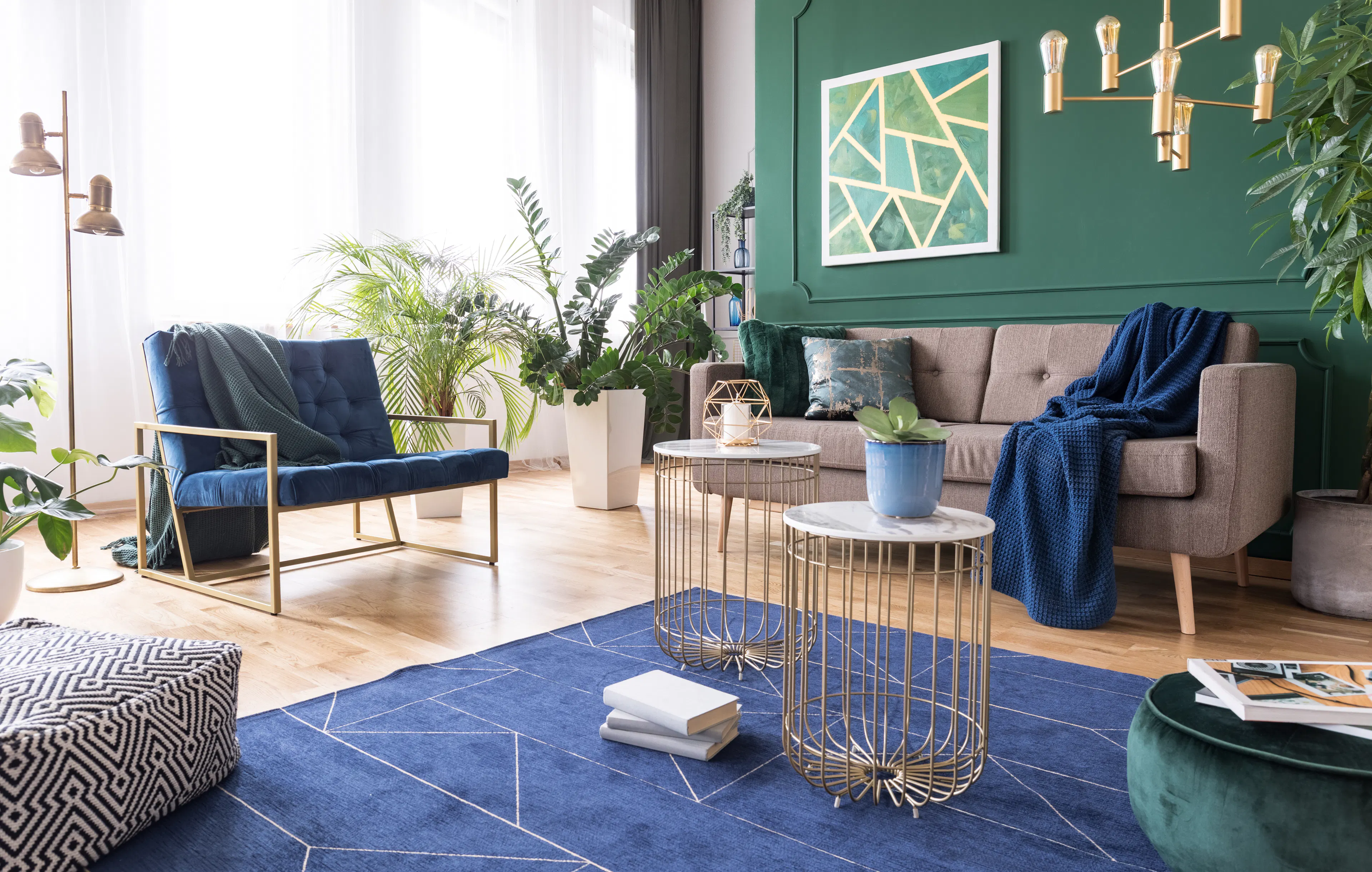 Green and blue living room interior design with rug, coffee tables