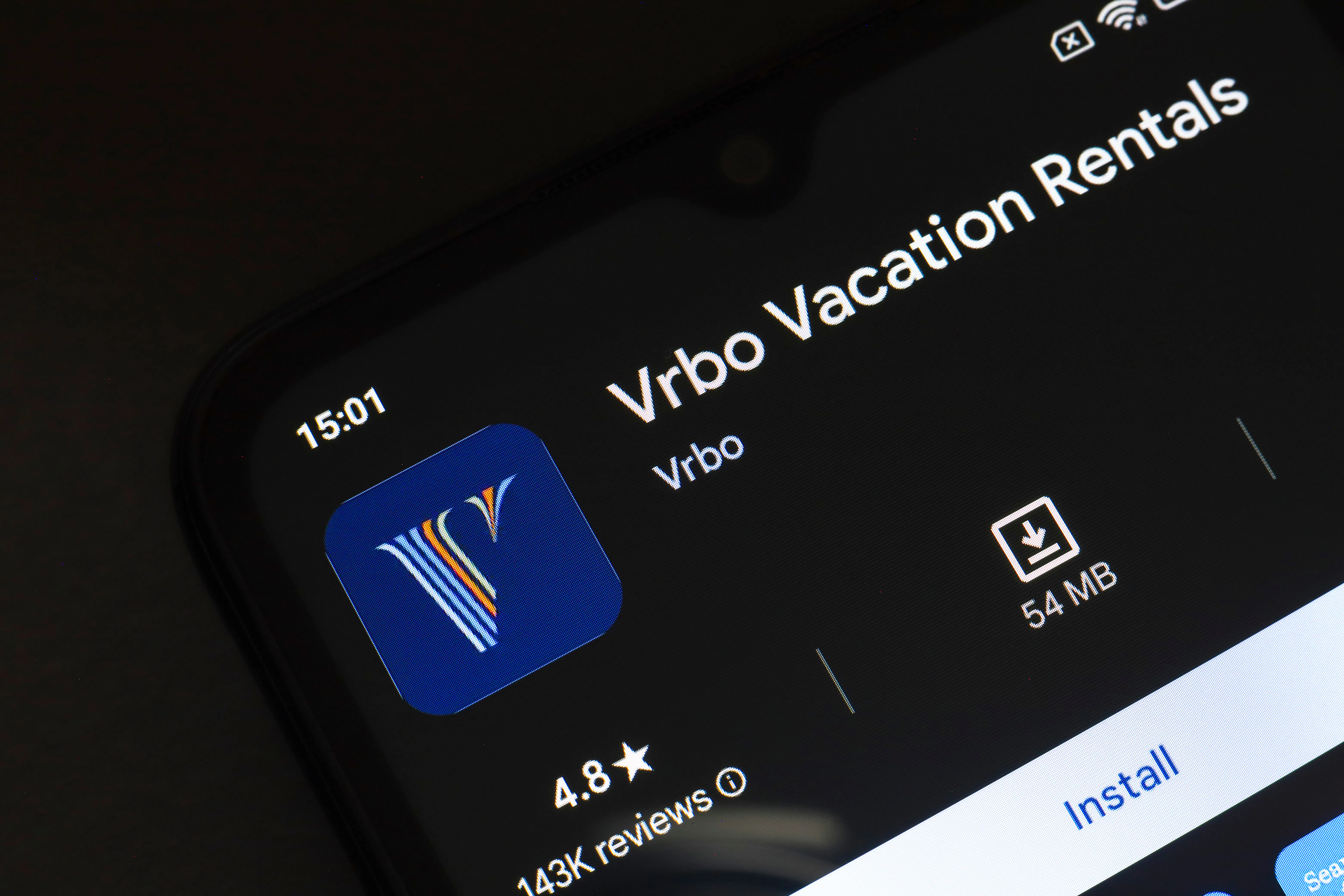 Vrbo app logo displayed on a smartphone screen