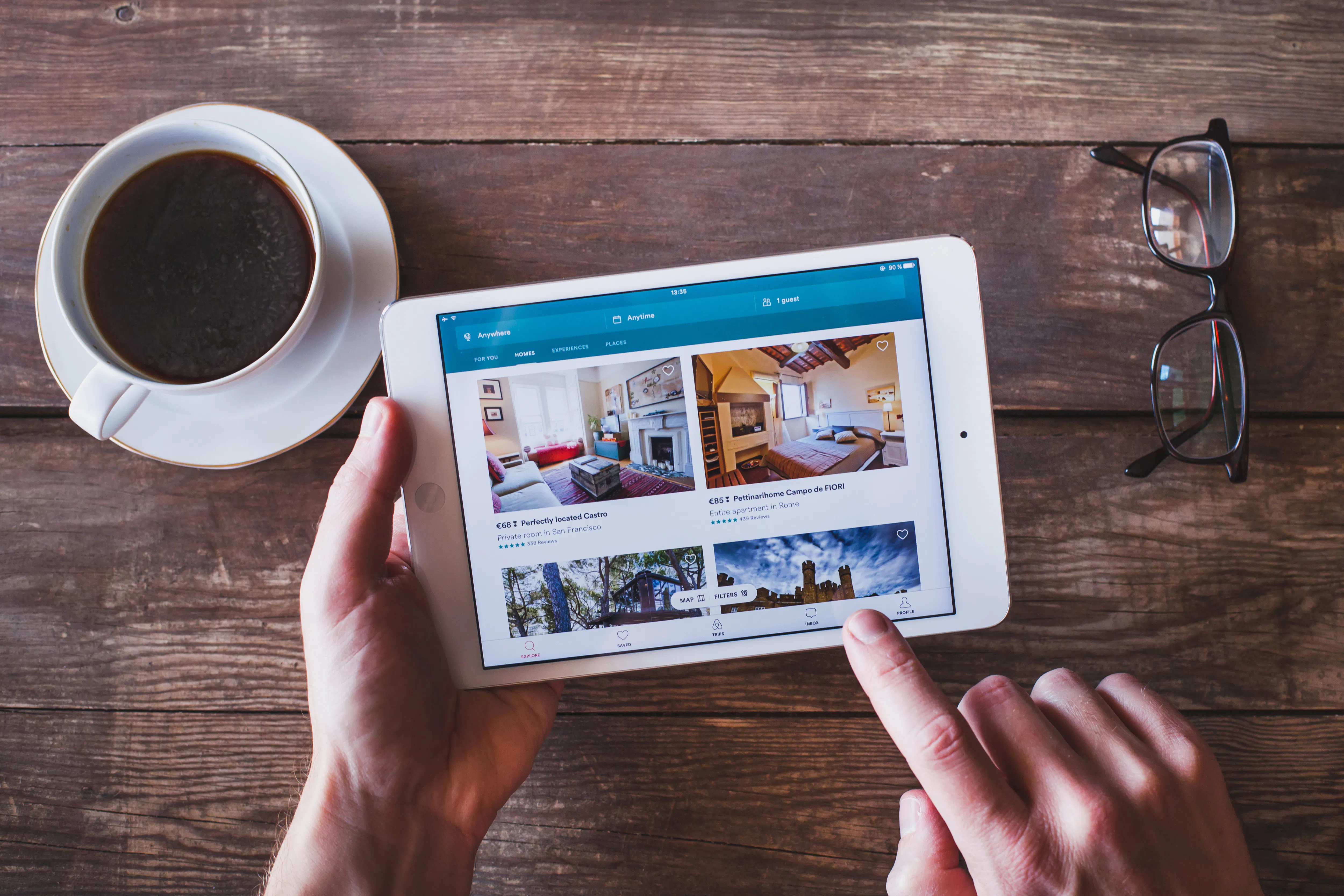 Person using the Airbnb app on a tablet.