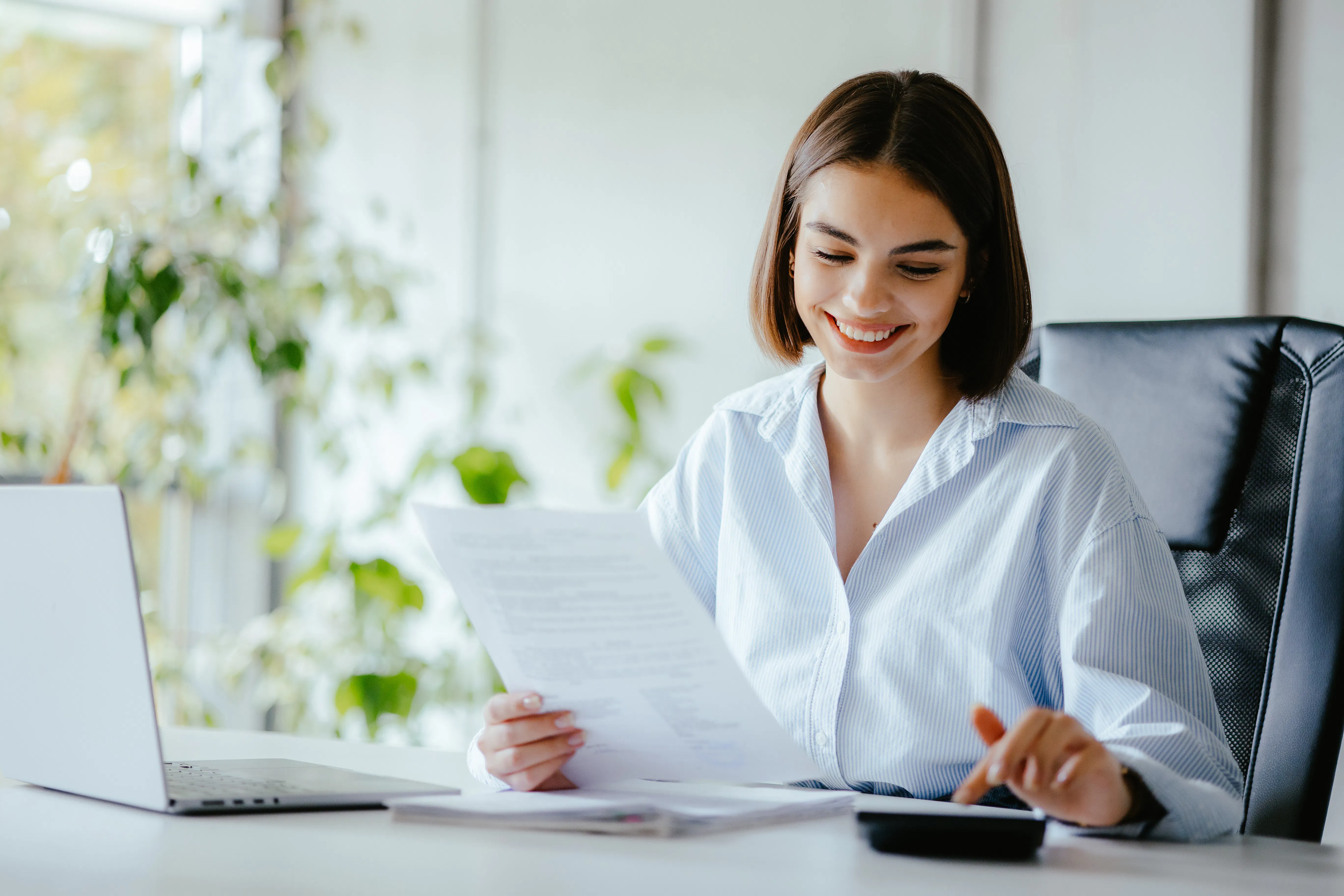 Young woman calculating yield.