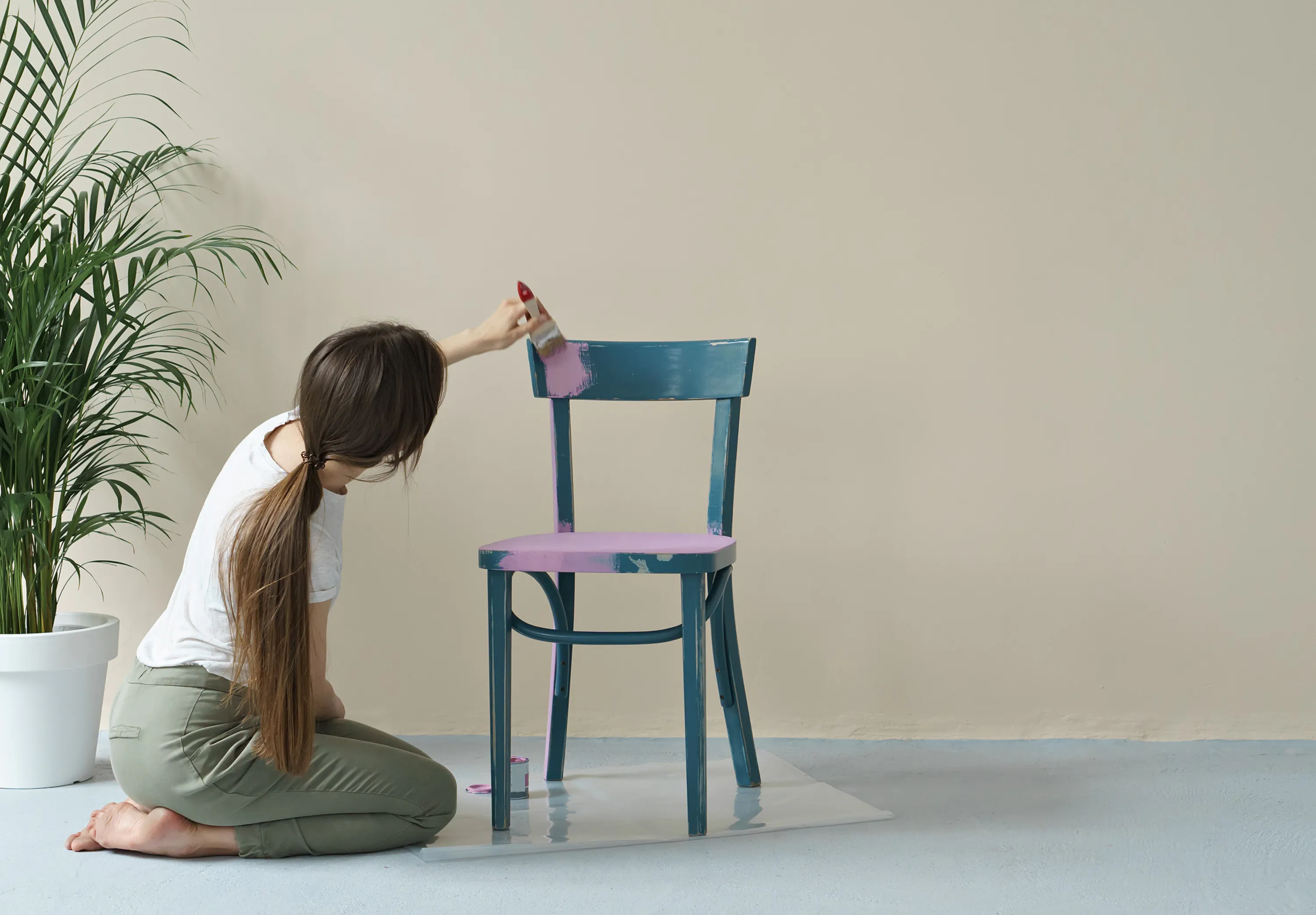Woman painting chair