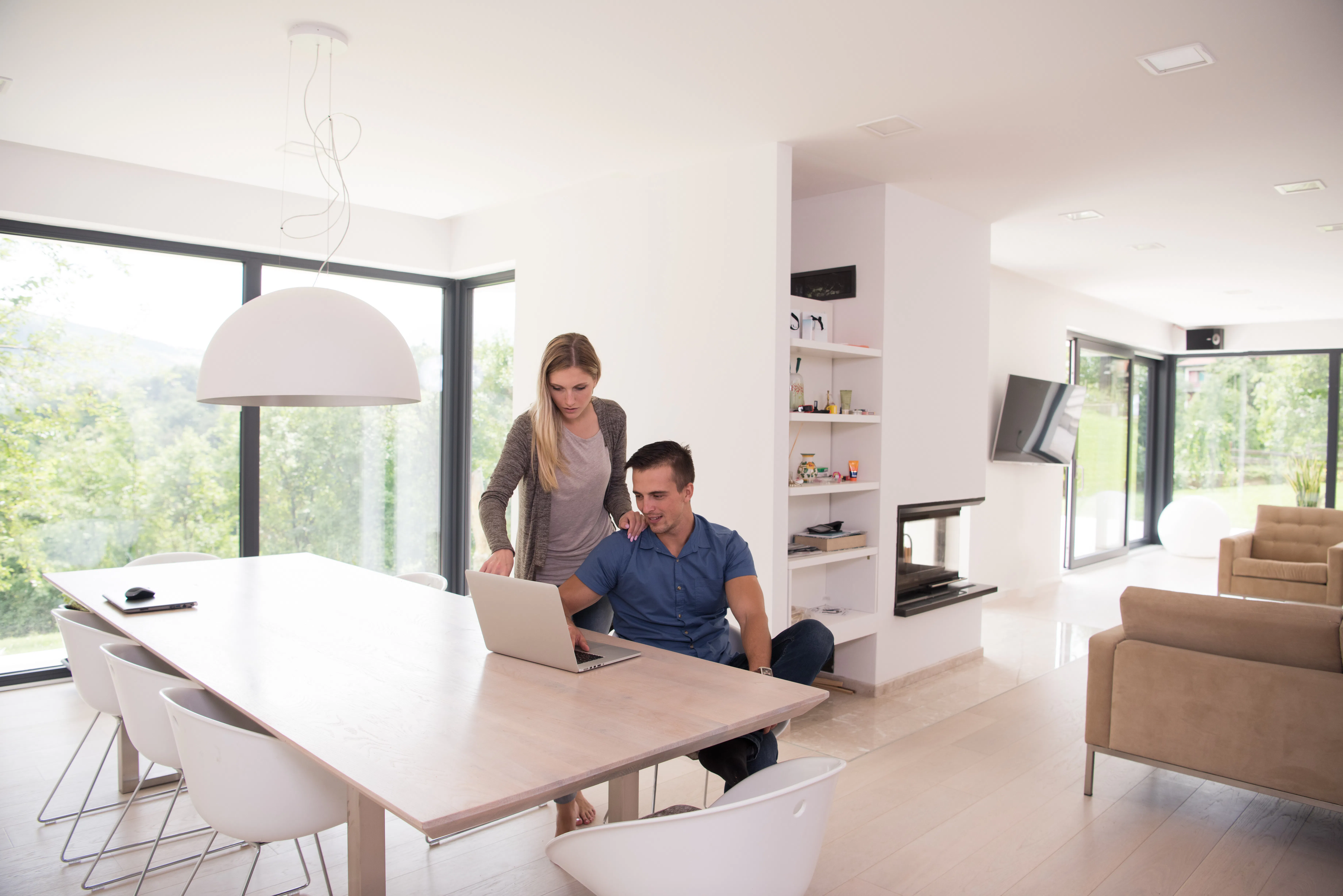 couple using laptop at home