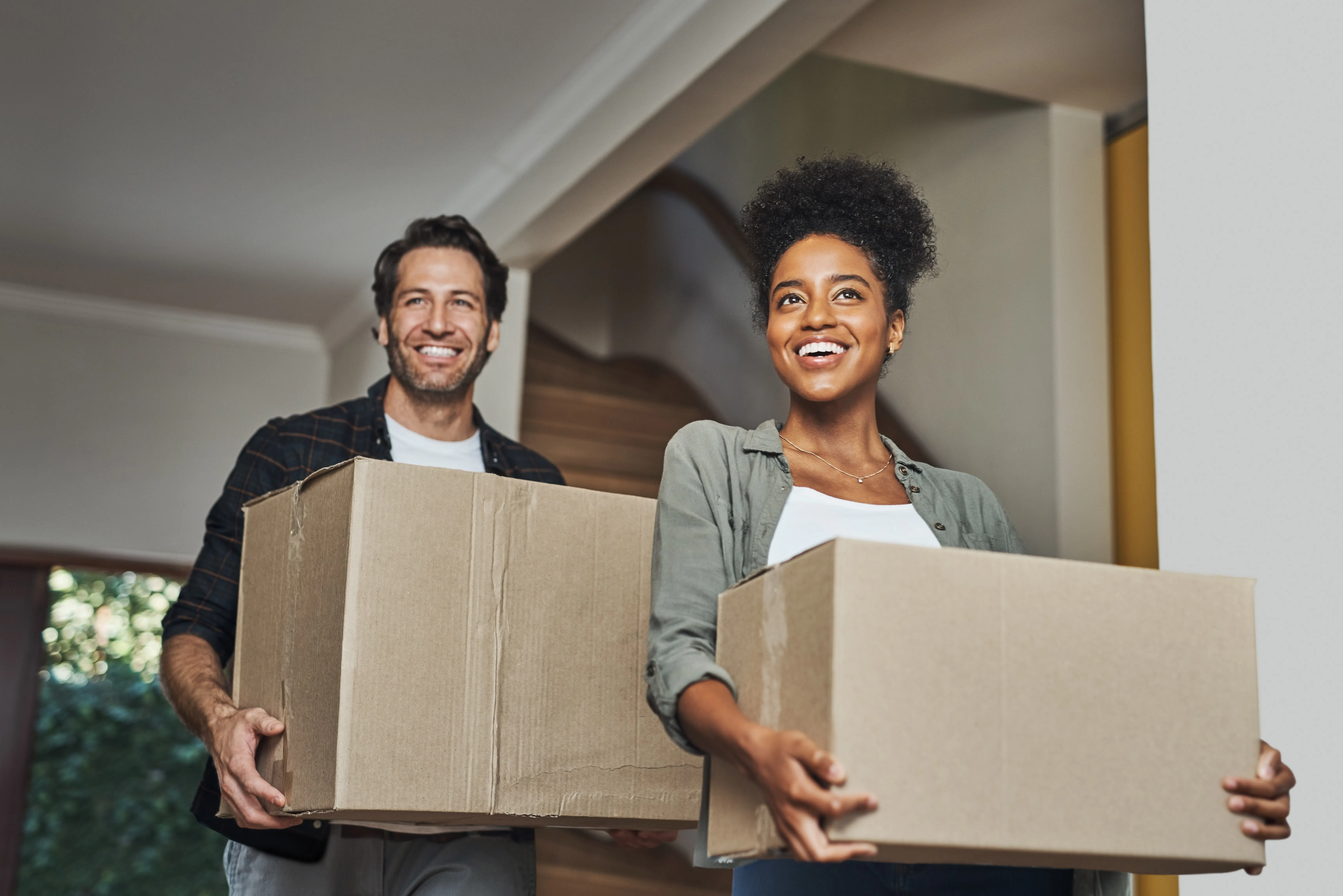 Couple moving in with boxes