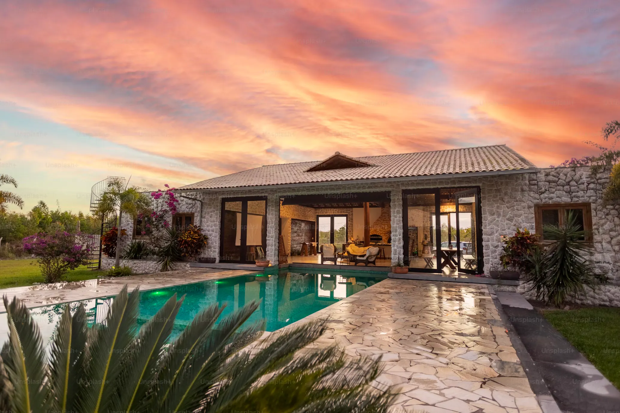 Luxury Airbnb with pool and sunset in background