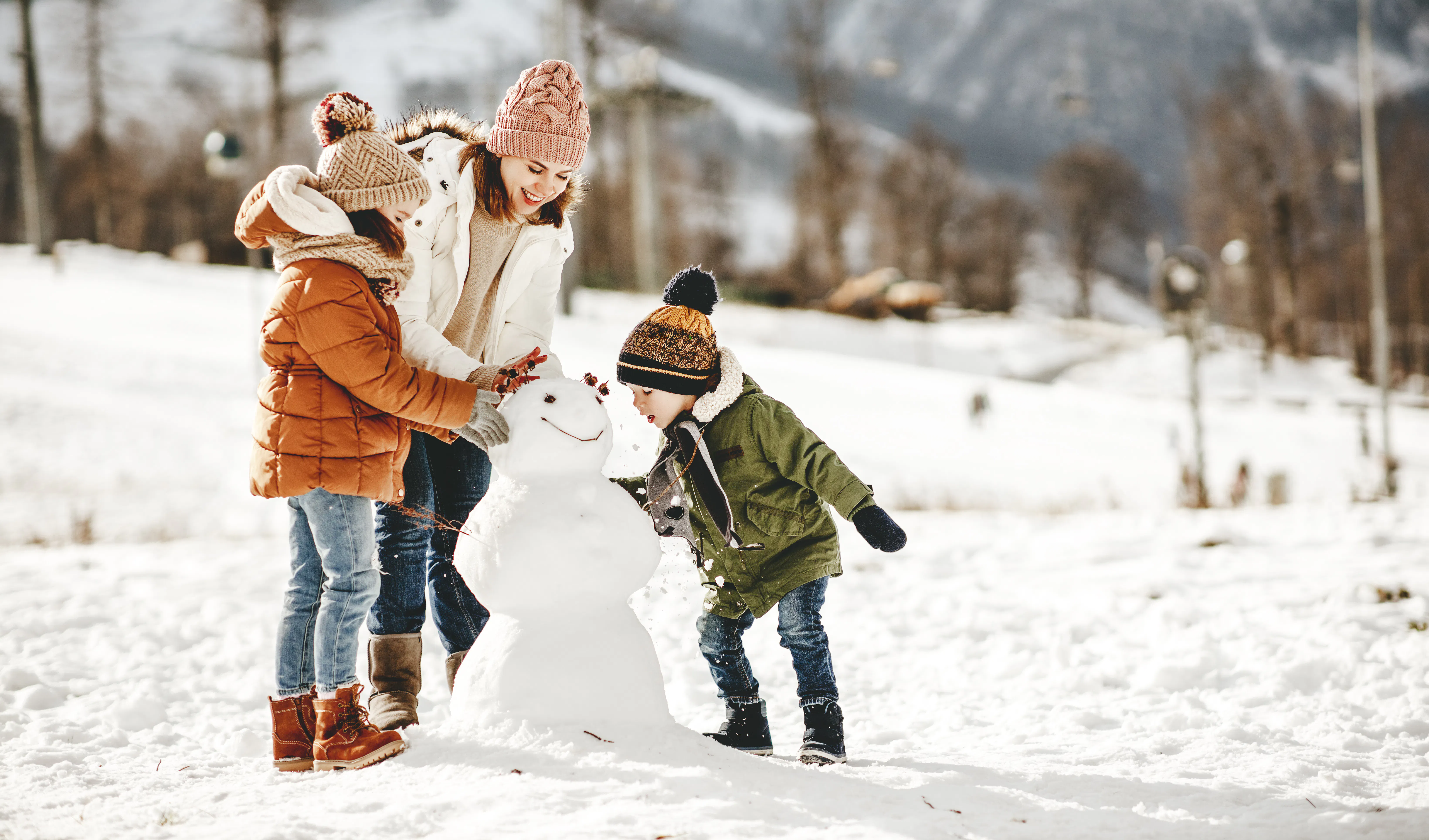 Family building snowman